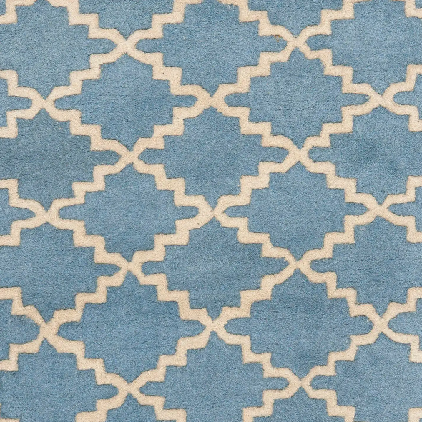 Chatham Notched Trellis Hand-Tufted Wool Rug in Blue Gray in a styled room