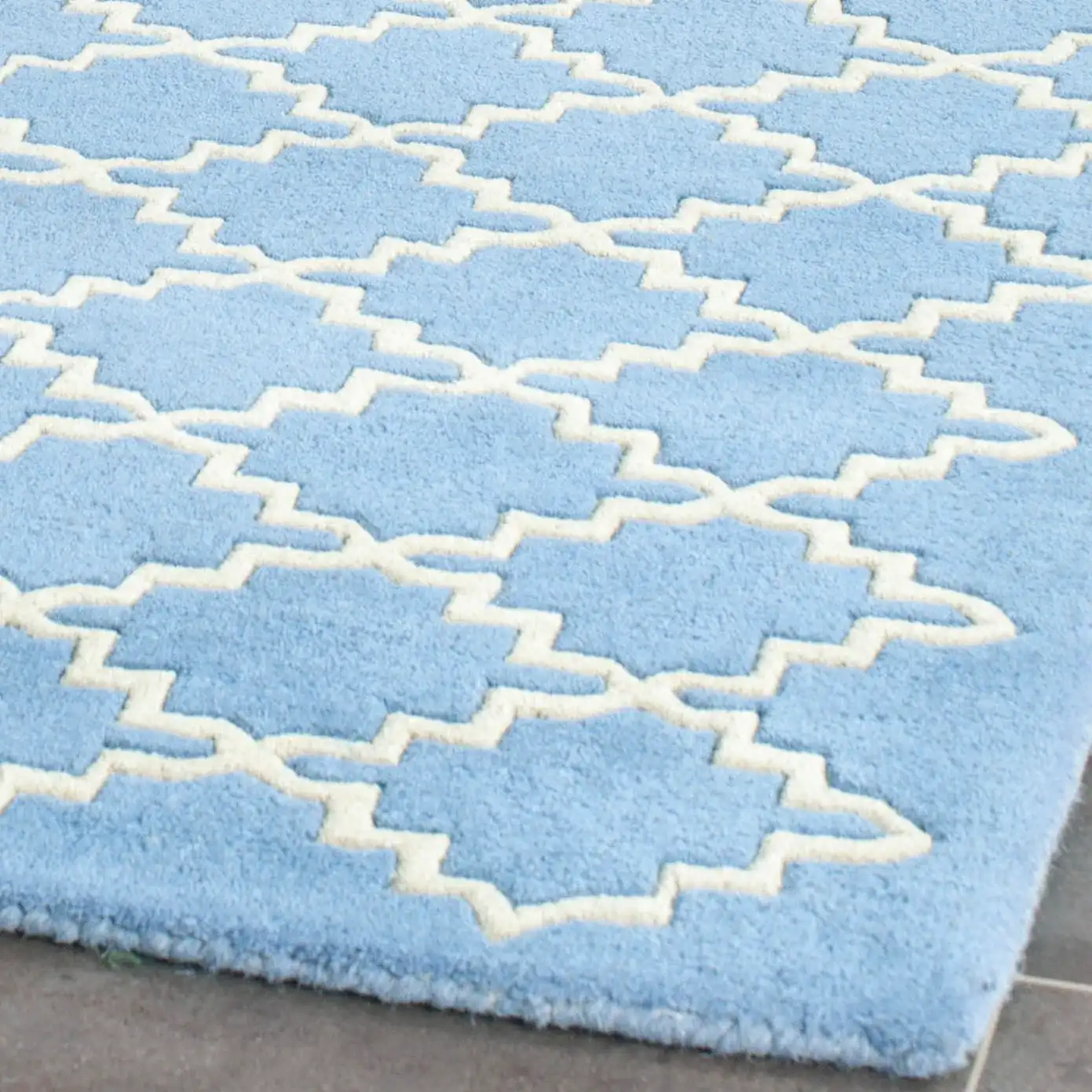 Chatham Notched Trellis Hand-Tufted Wool Rug in Blue Gray in a styled room