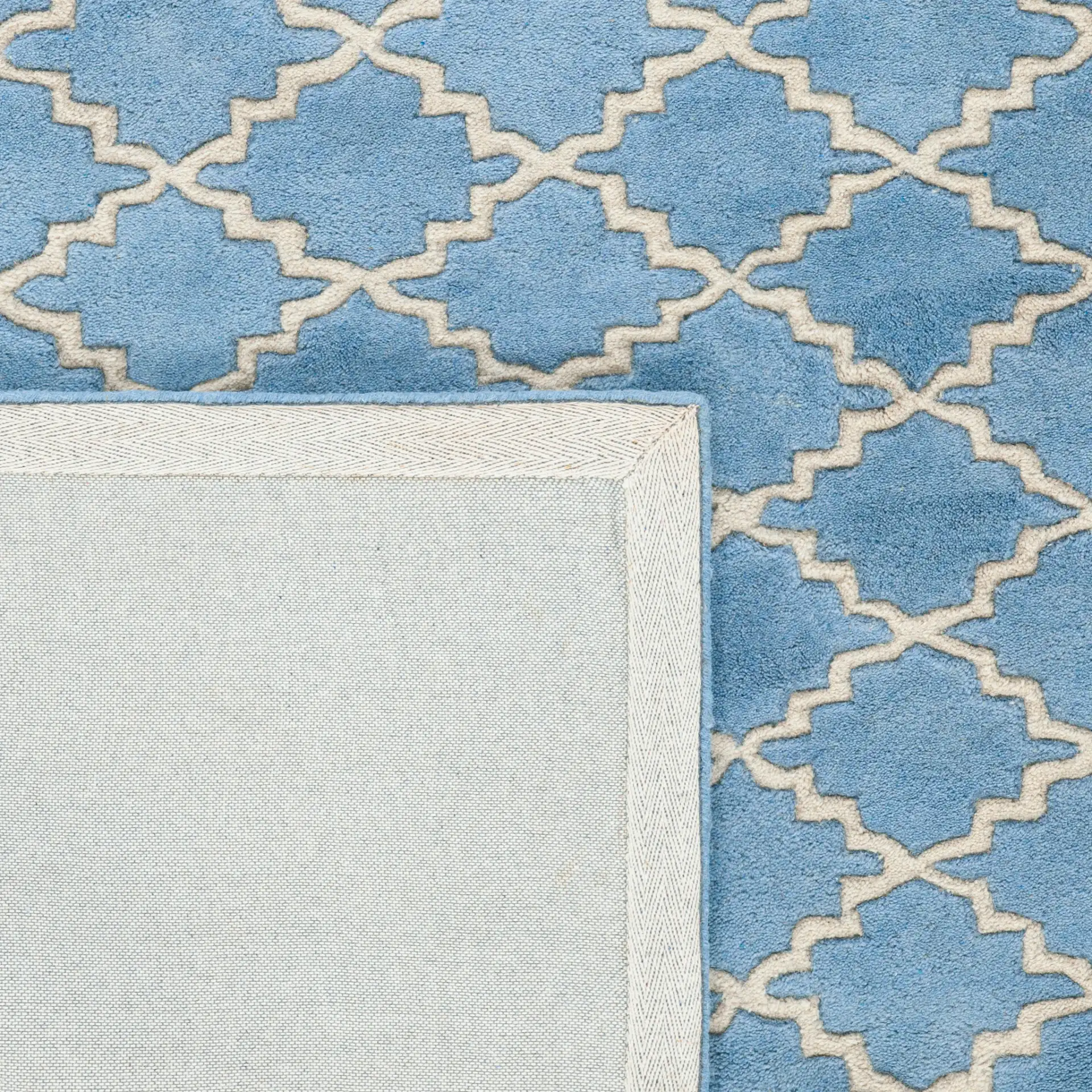 Chatham Notched Trellis Hand-Tufted Wool Rug in Blue Gray in a styled room