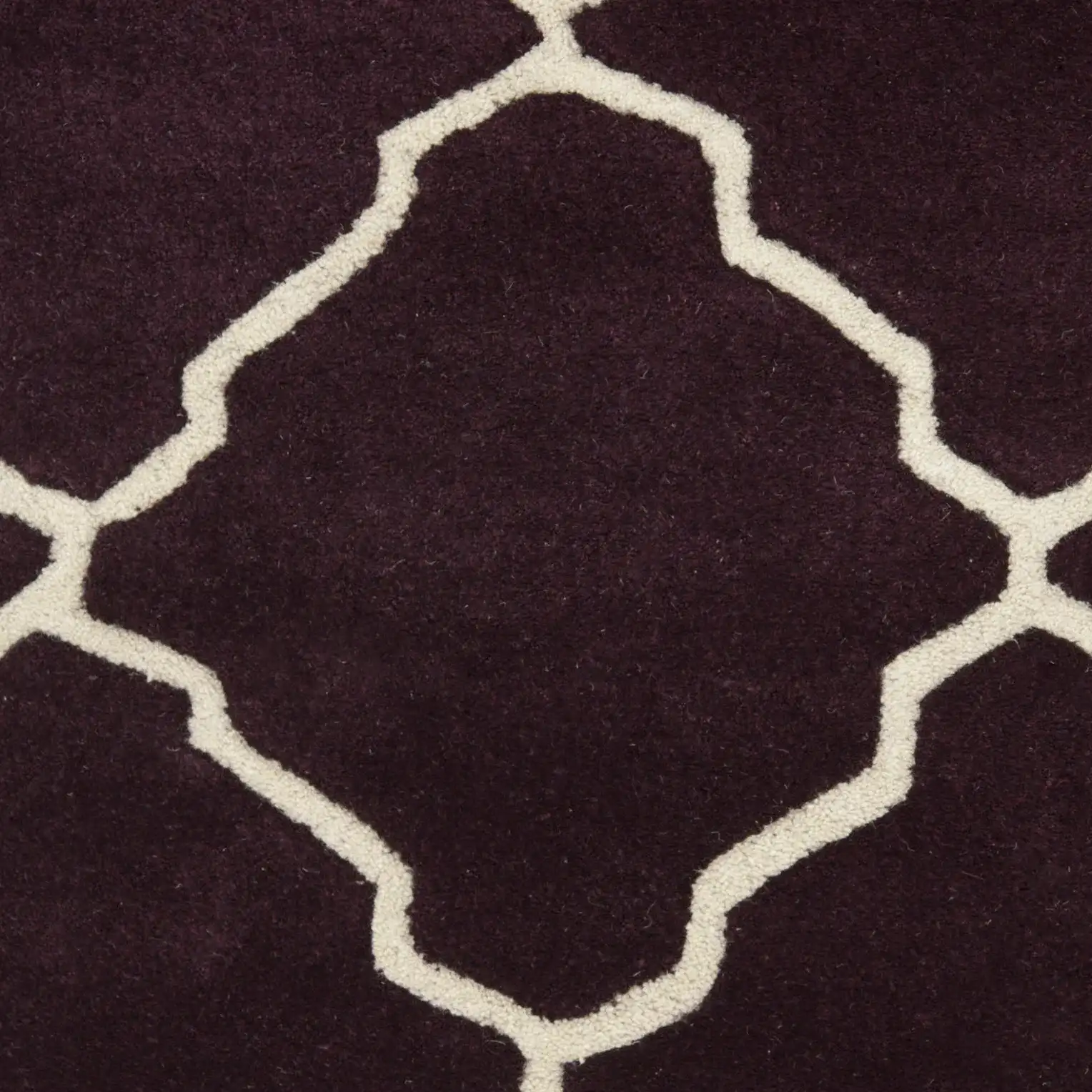 Chatham Stepped Diamond Trellis Hand-Tufted Wool Rug in Dark Purple in a styled room
