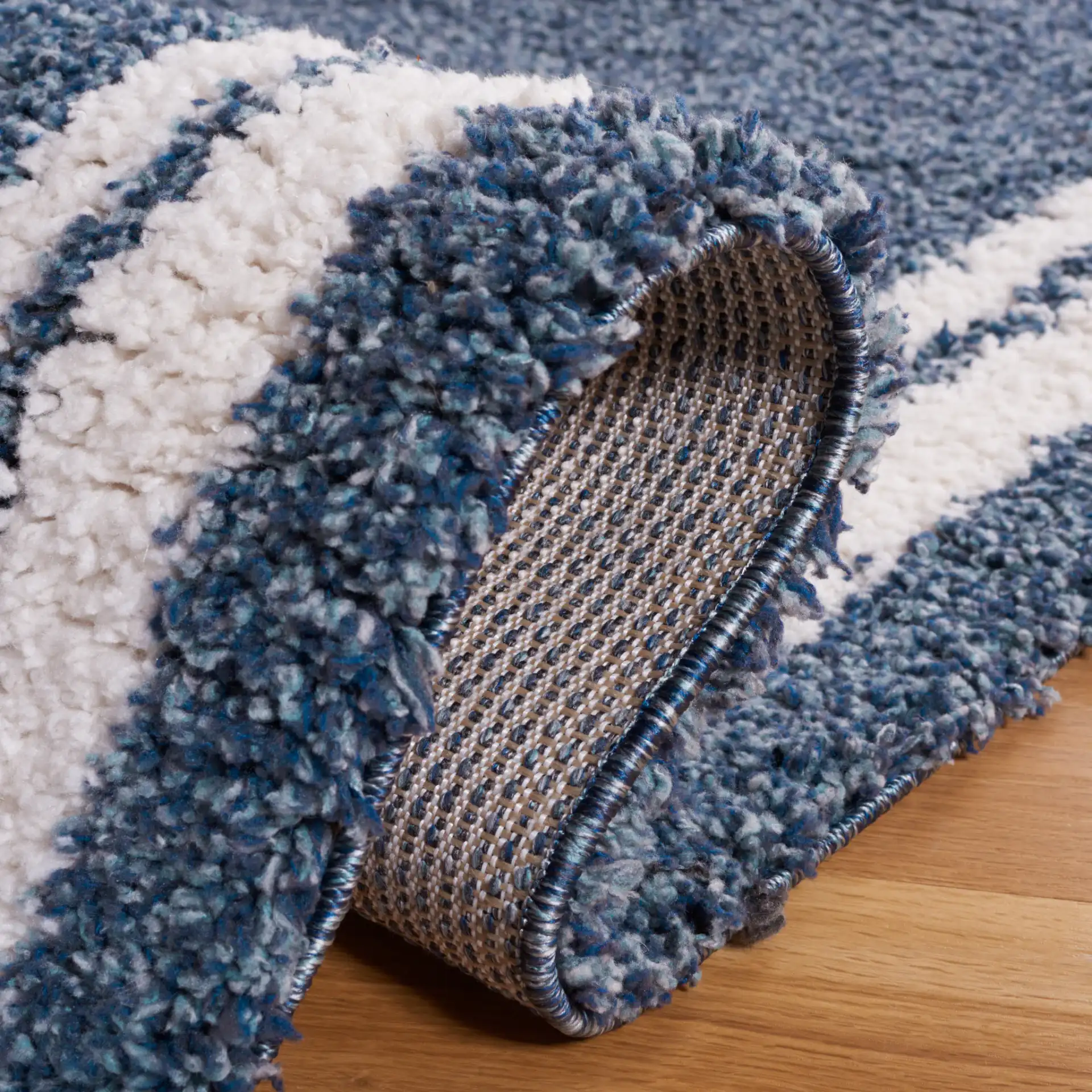 Calico Double Border Shag Rug in Blue / Ivory in a styled room