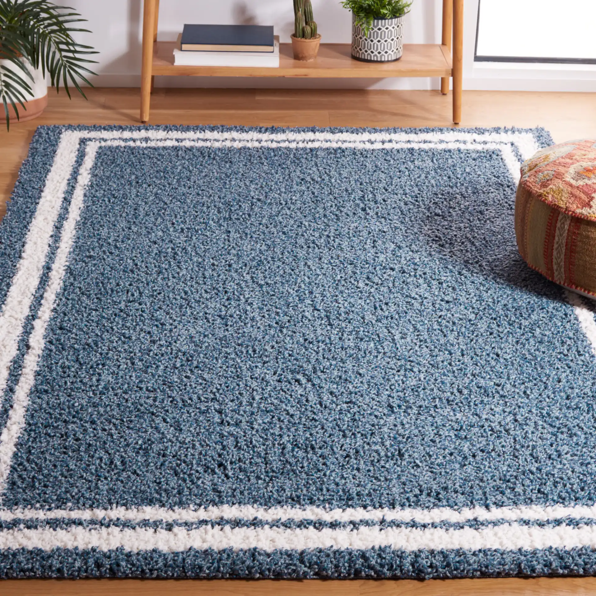 Calico Double Border Shag Rug in Blue / Ivory in a styled room
