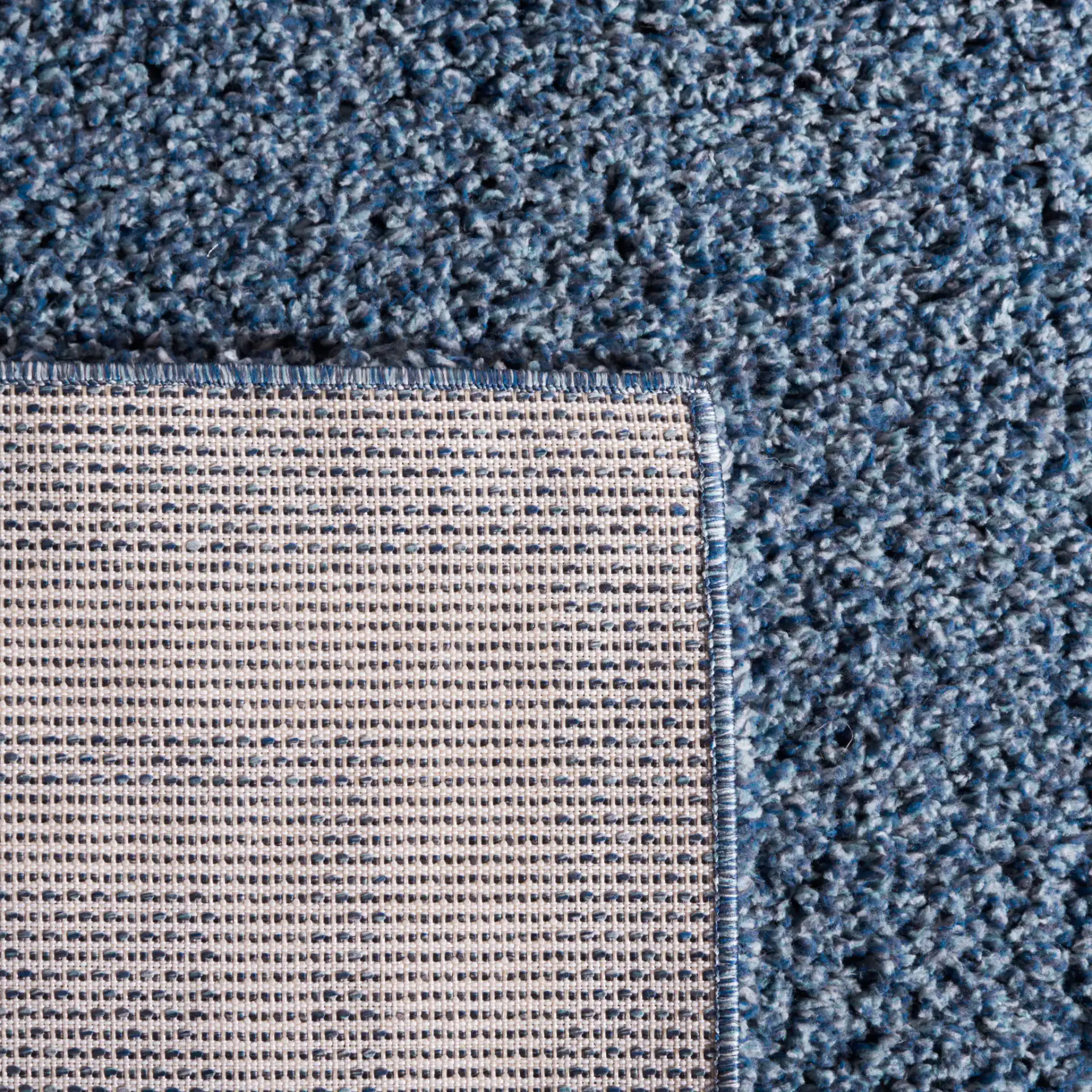 Calico Double Border Shag Rug in Blue / Ivory in a styled room