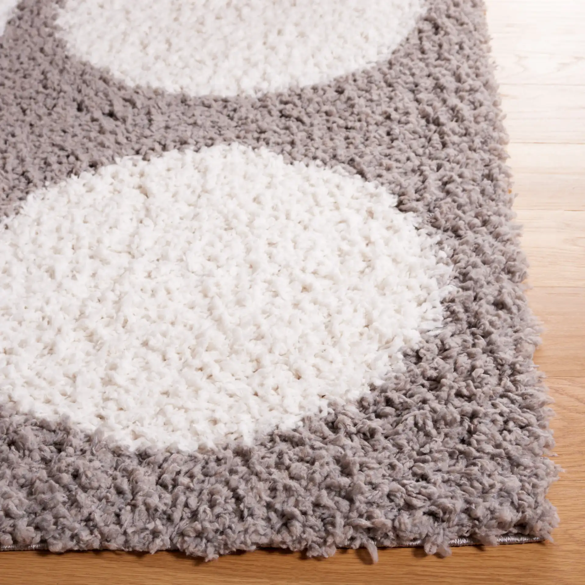 Calico Polka Dot Shag Rug in Gray / Ivory in a styled room