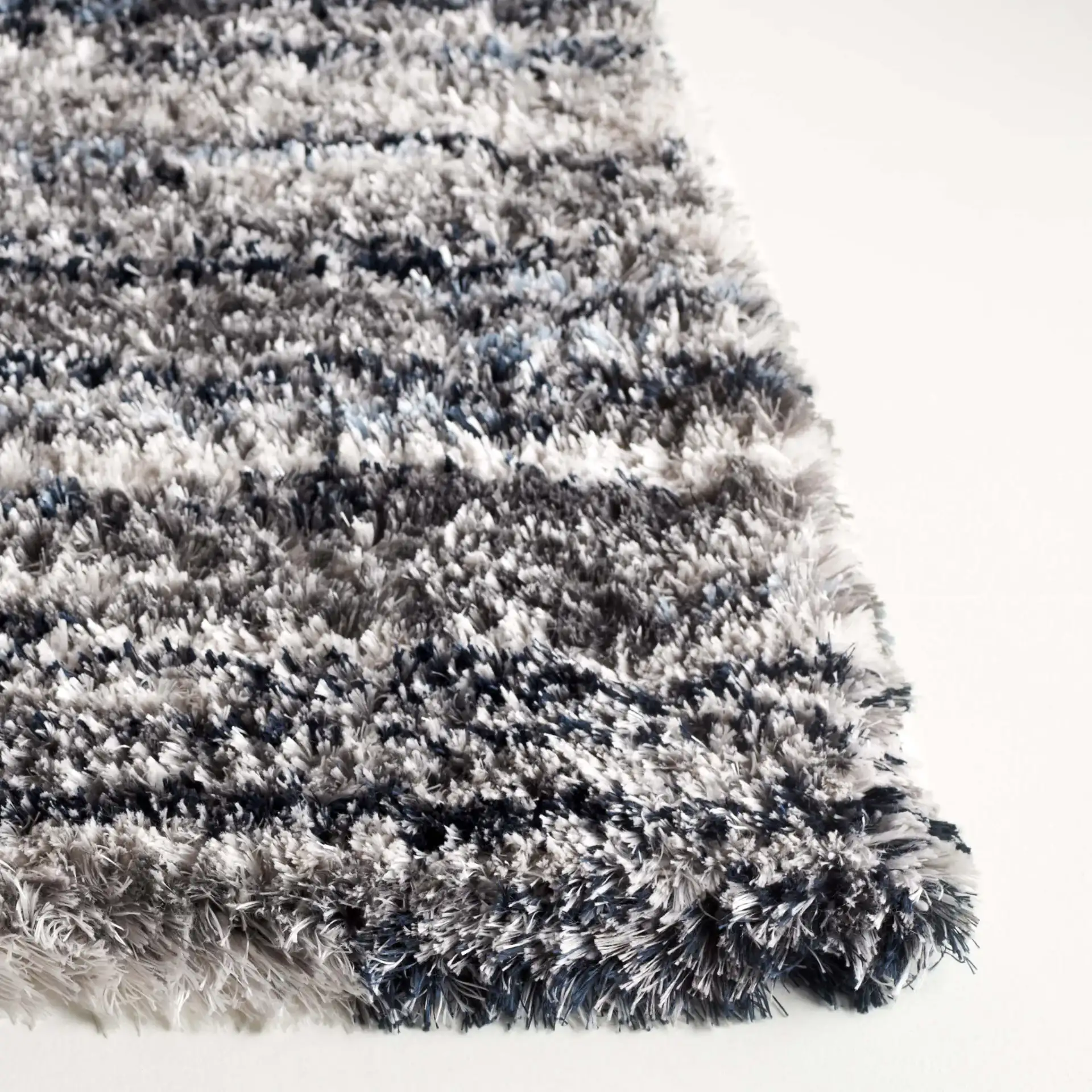 Cloud Striped Shag Rug in Gray / Blue in a styled room