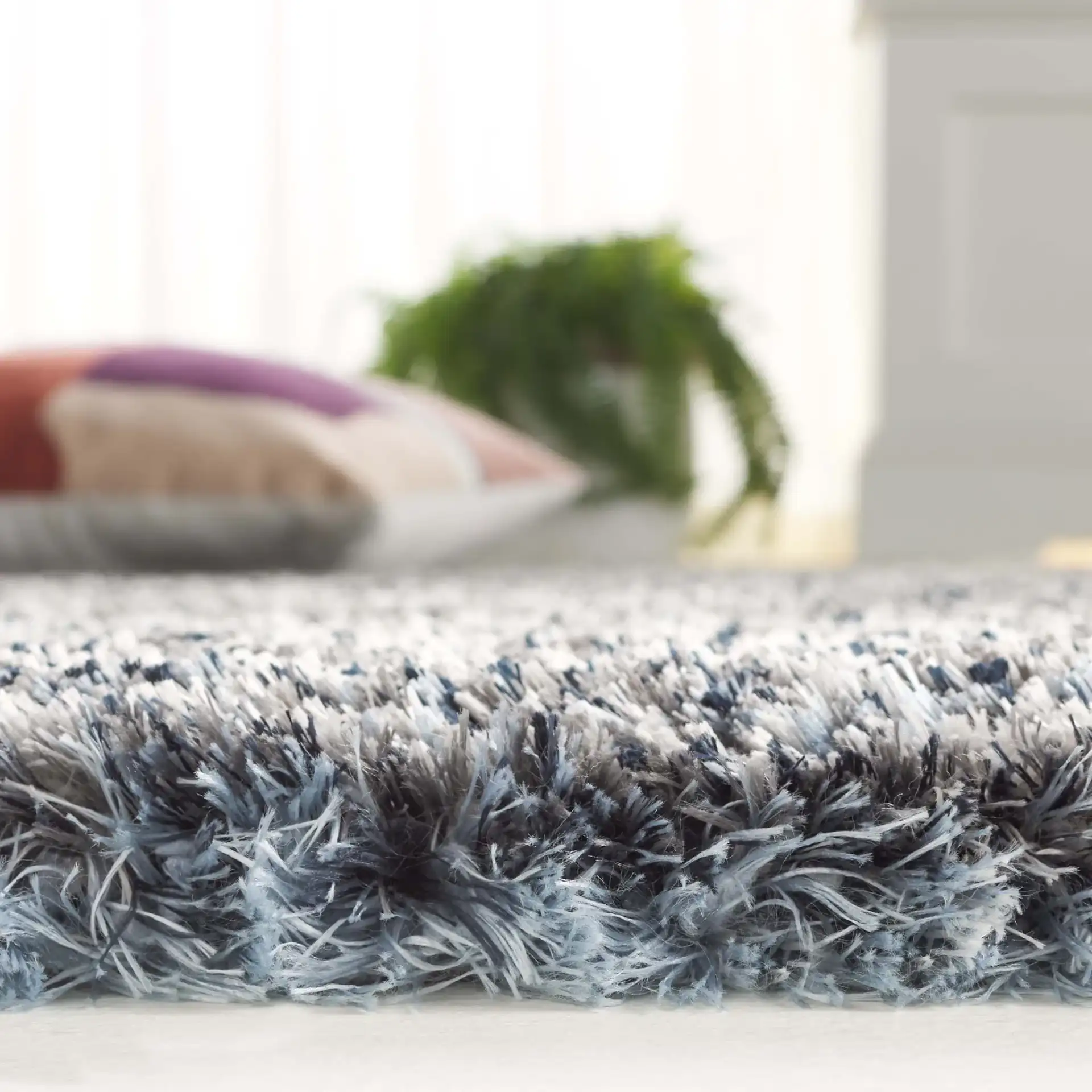 Cloud Striped Shag Rug in Gray / Blue in a styled room