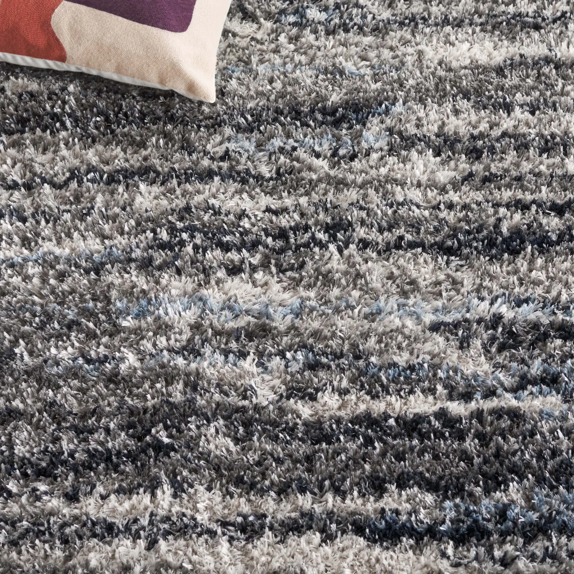 Cloud Striped Shag Rug in Gray / Blue in a styled room