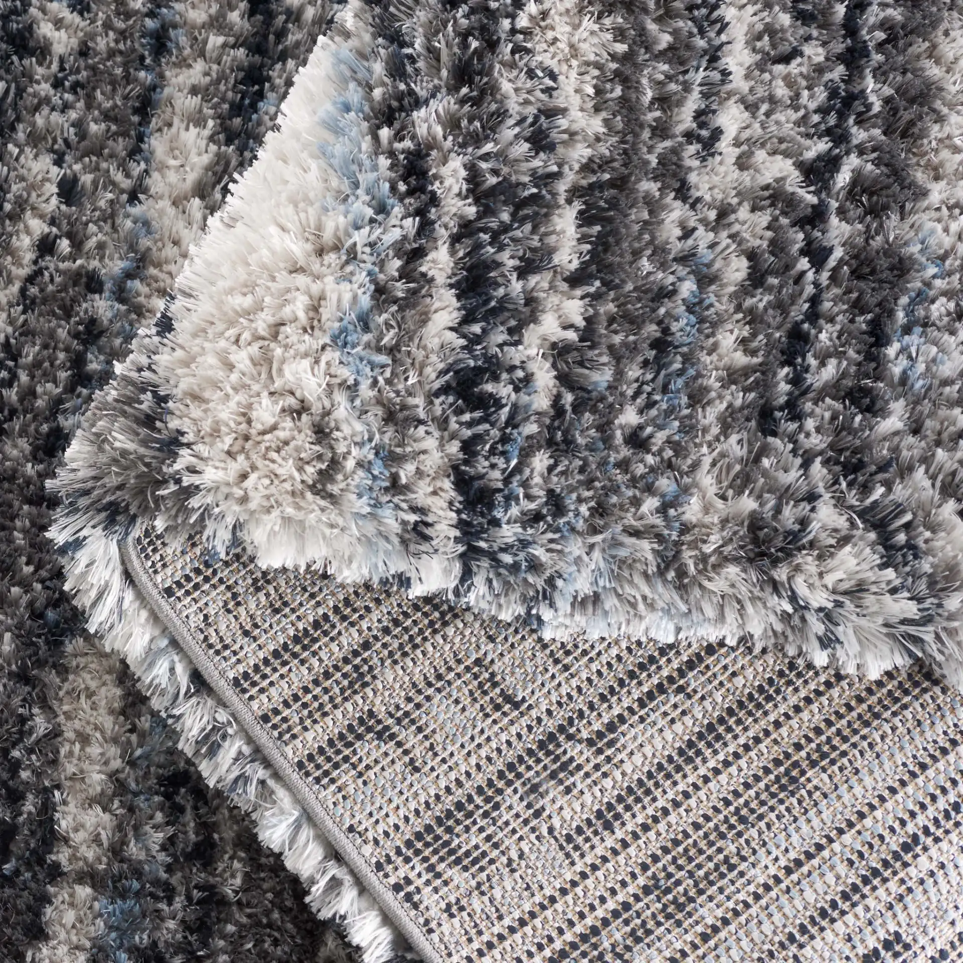 Cloud Striped Shag Rug in Gray / Blue in a styled room