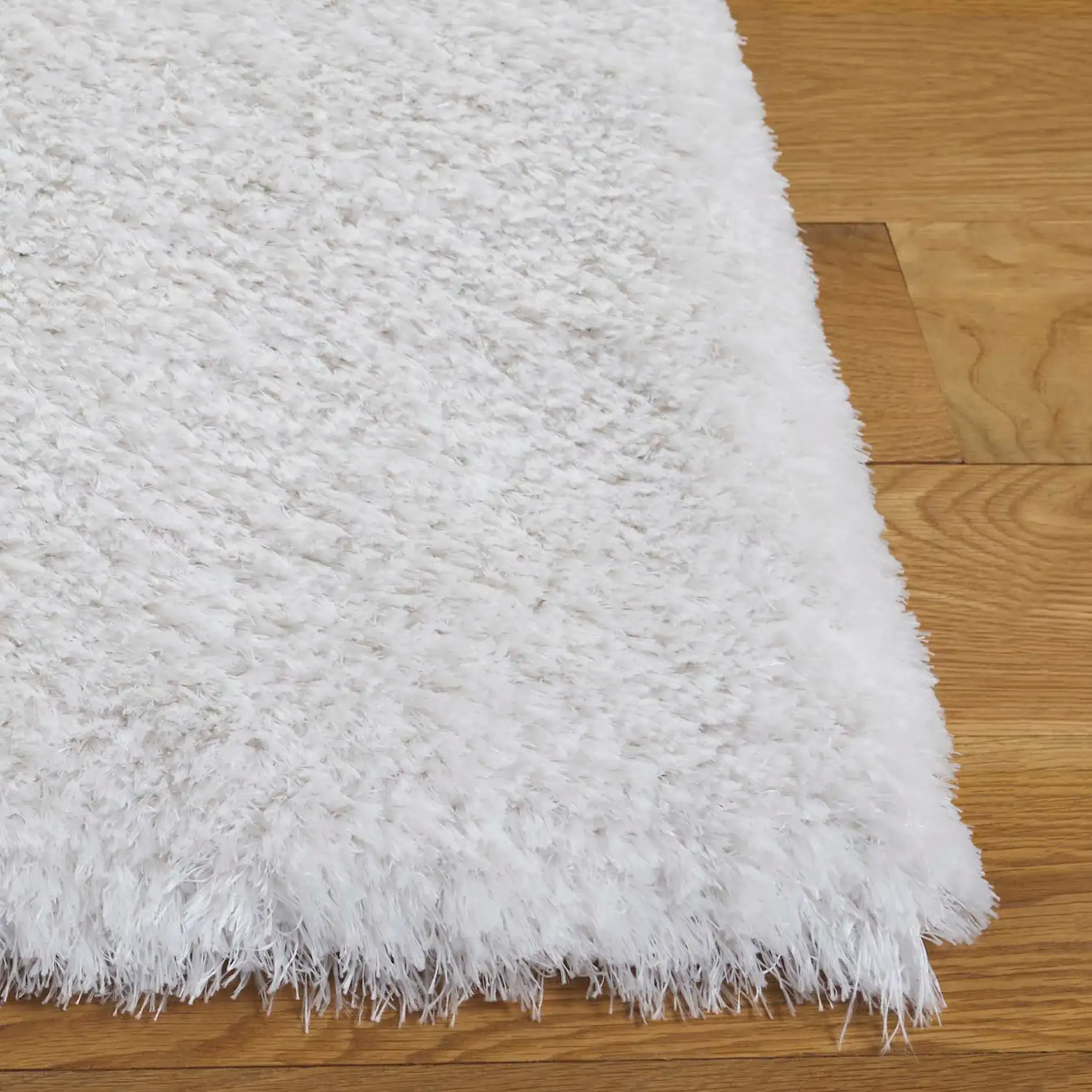Cloud Solid Shag Rug in White in a styled room