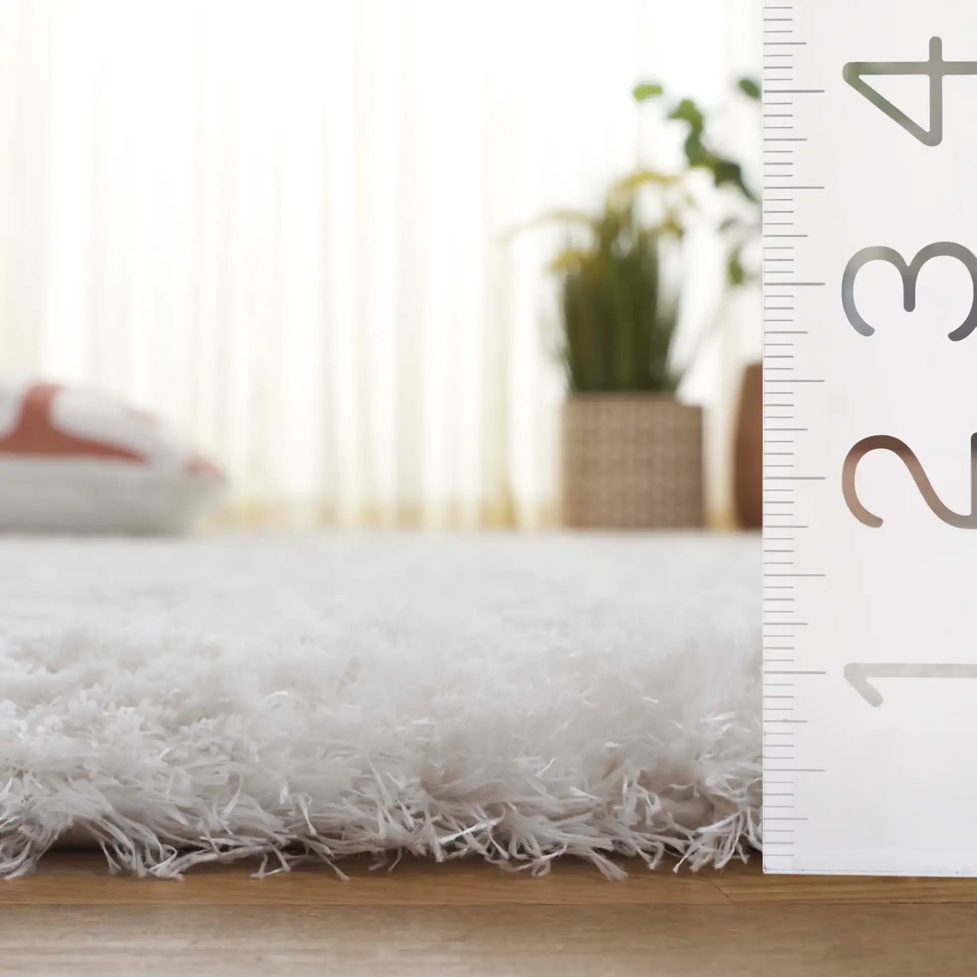 Cloud Solid Shag Rug in White in a styled room