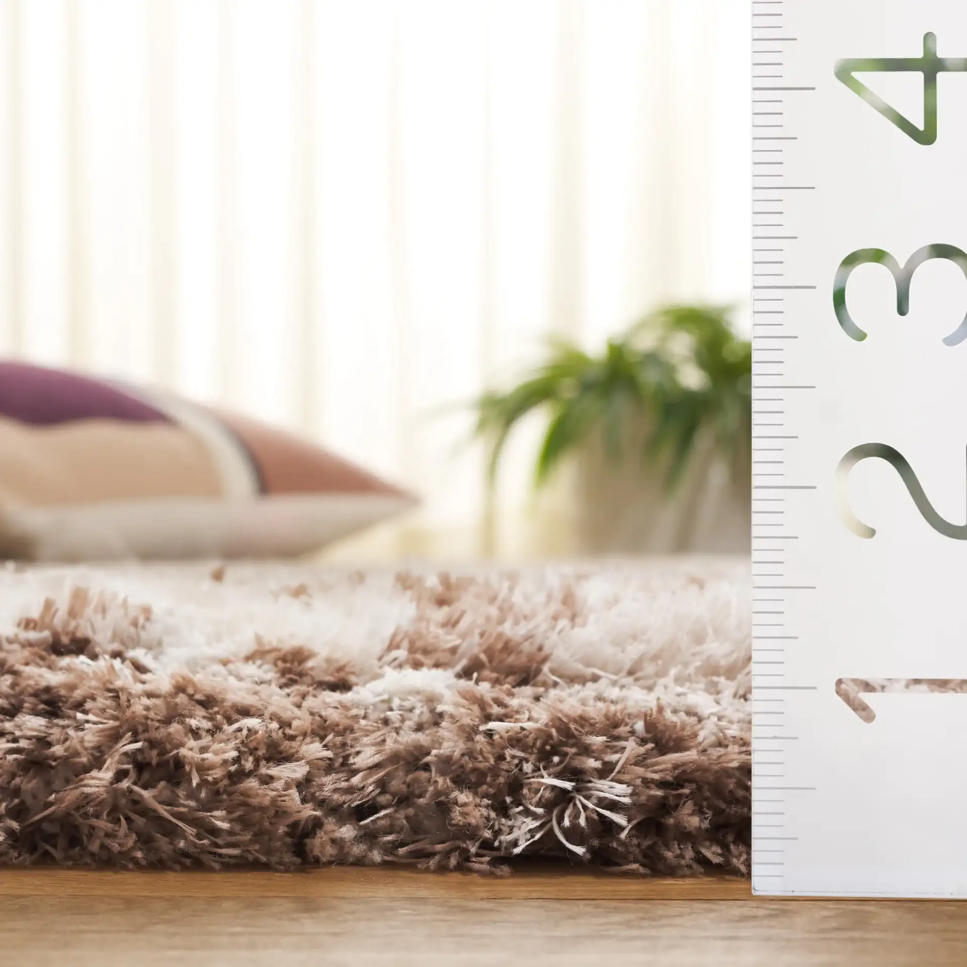 Cloud Abstract Splatter Shag Rug in Ivory / Brown in a styled room