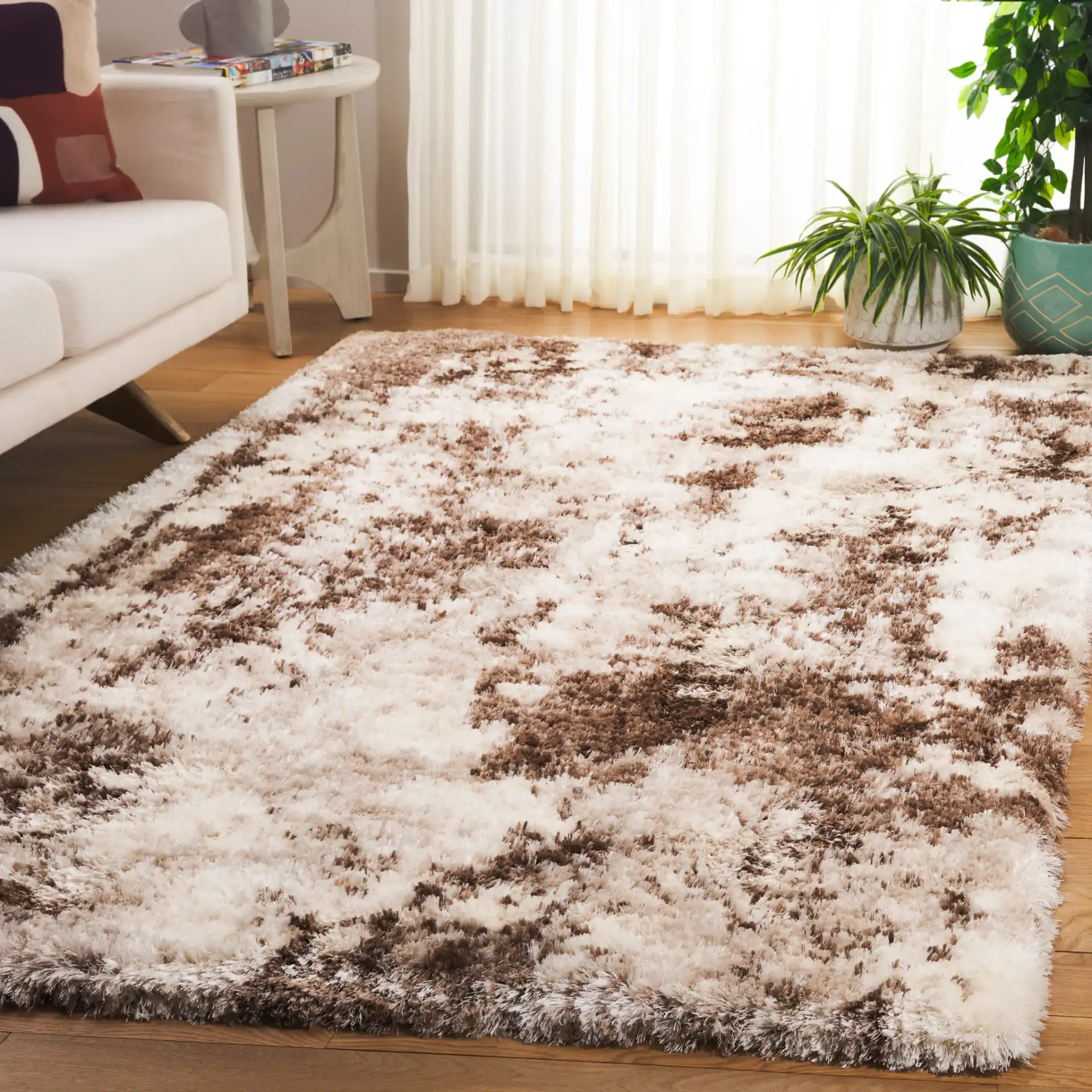 Cloud Abstract Splatter Shag Rug in Ivory / Brown in a styled room