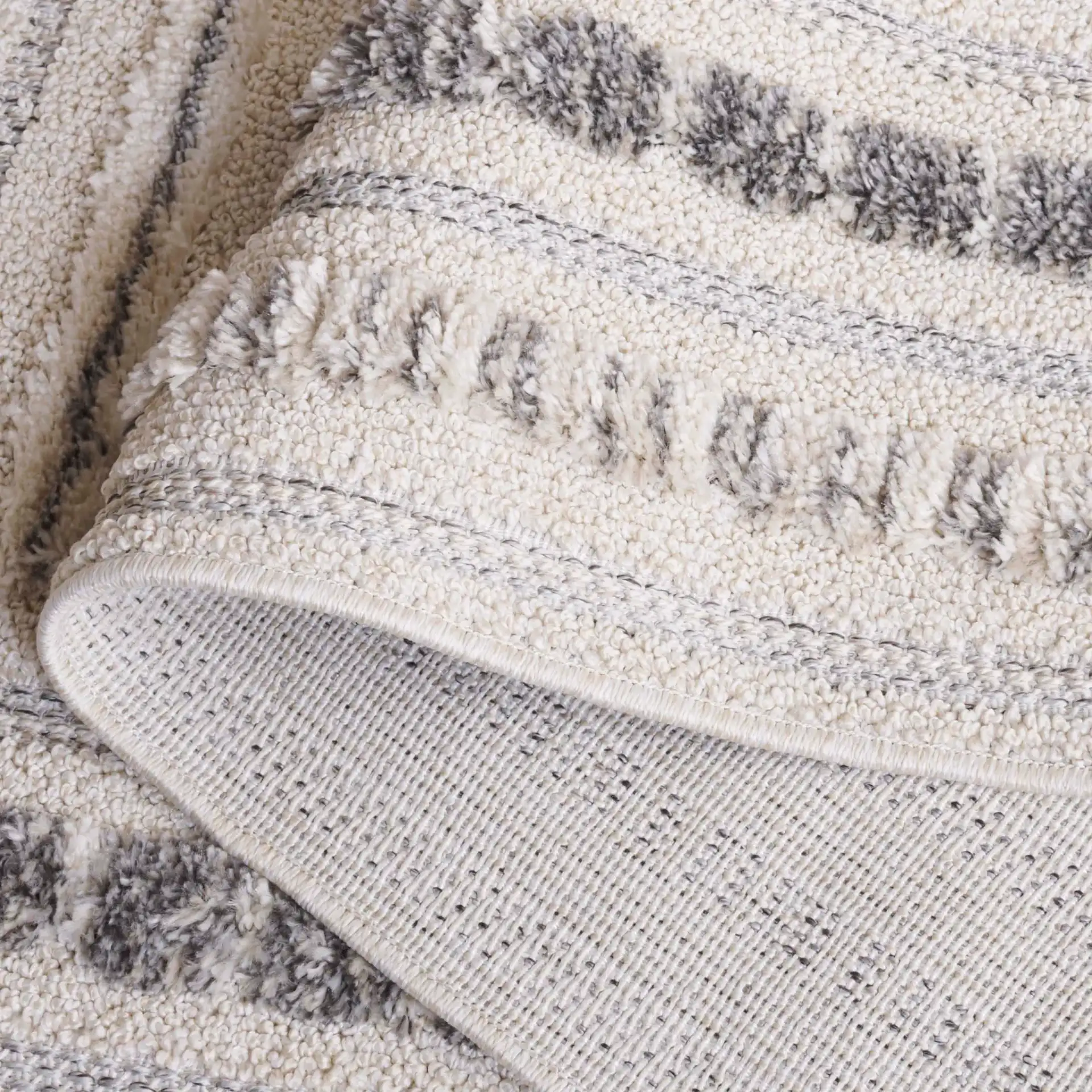 Chloe Concentric Square Rug in Ivory / Gray in a styled room