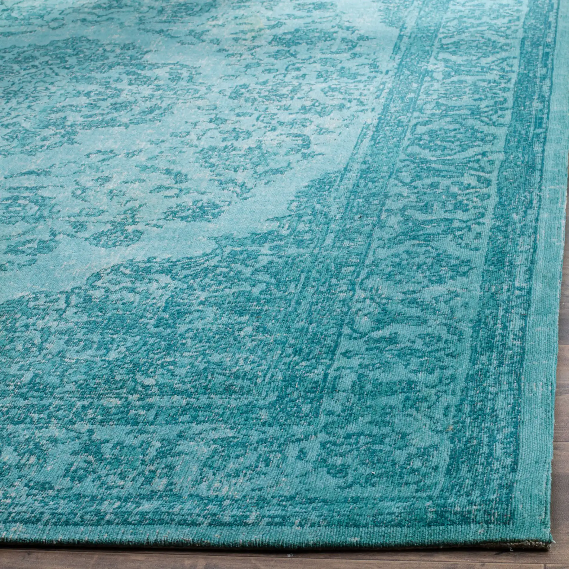 Classic Vintage Floral Medallion Rug in Aqua in a styled room