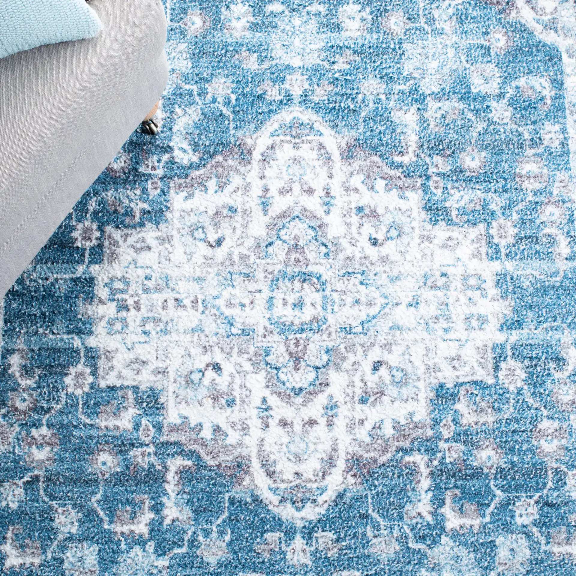 Classic Vintage Traditional Medallion Hand-Tufted Rug in Blue / Gray in a styled room