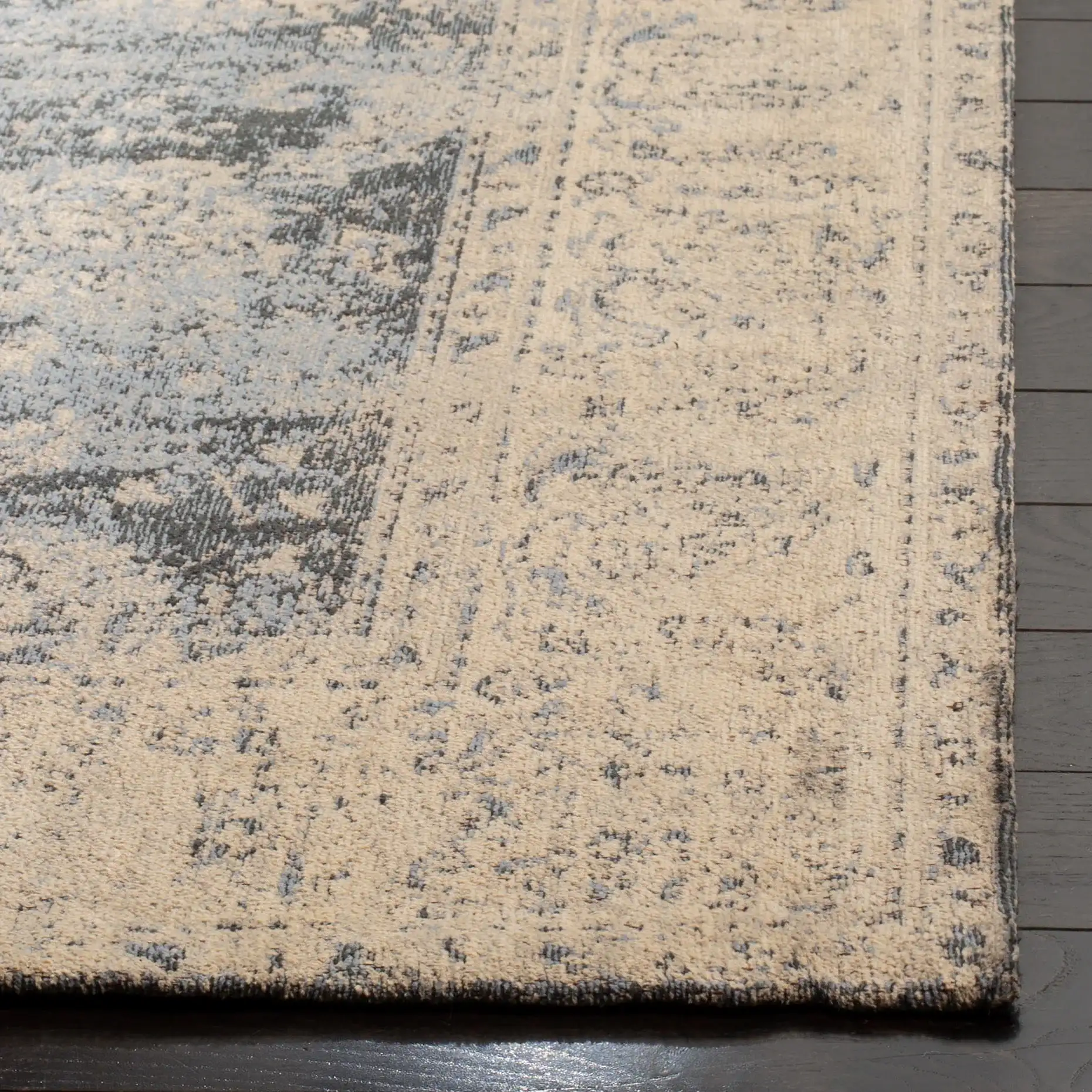 Classic Vintage Bordered Botanical Rug in Cream / Gray in a styled room