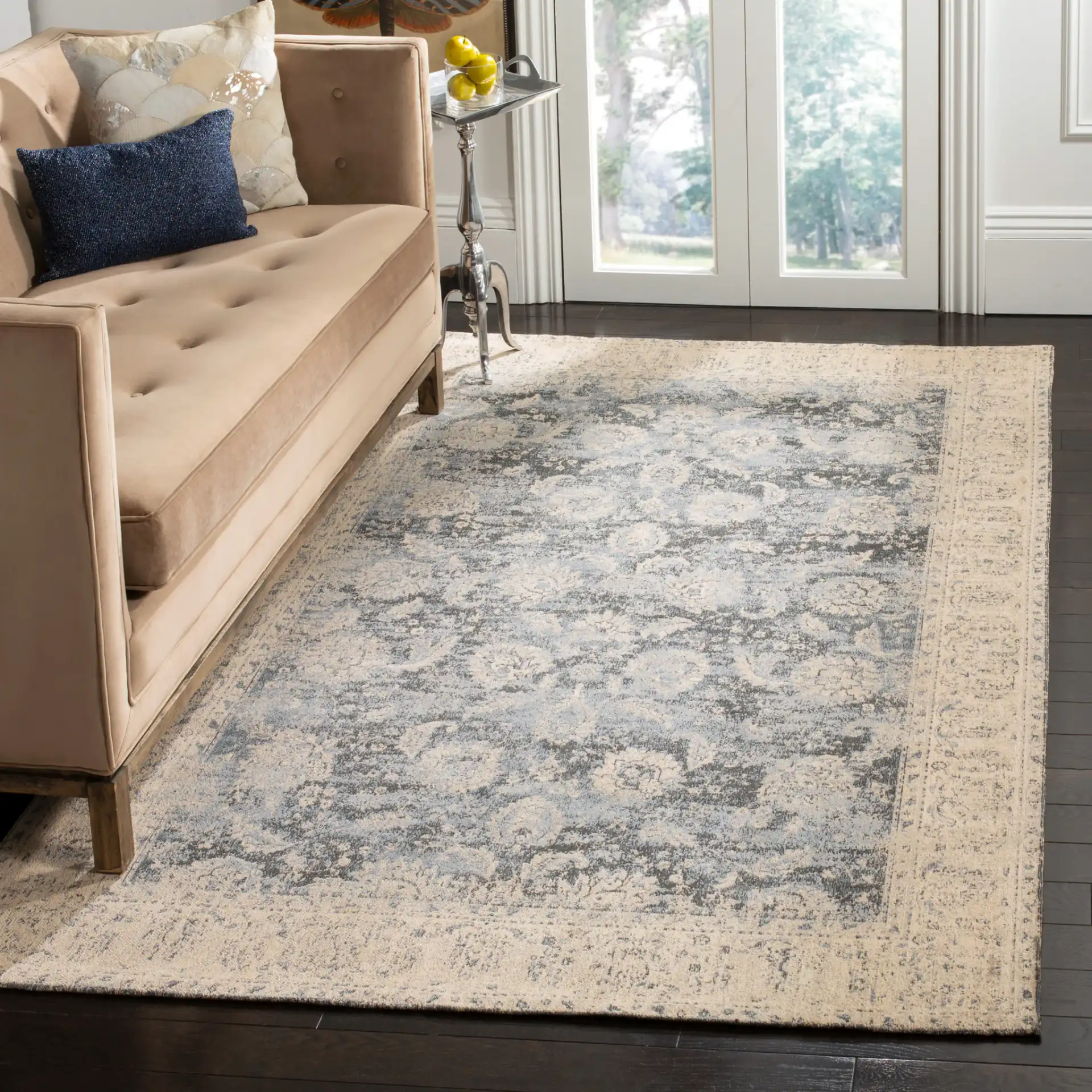 Classic Vintage Bordered Botanical Rug in Cream / Gray in a styled room