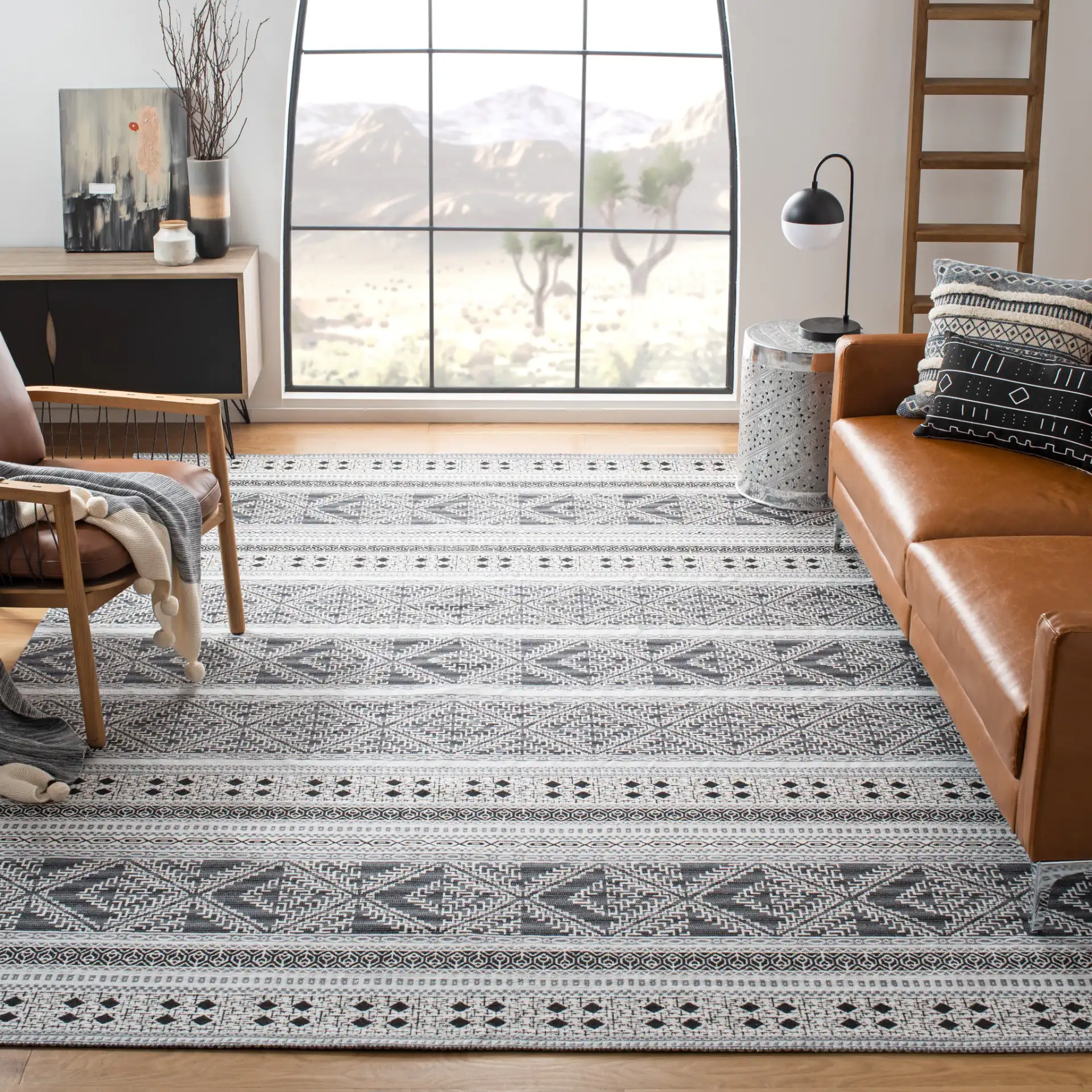 Classic Vintage Bohemian Geometric Hand-Woven Rug in Black in a styled room