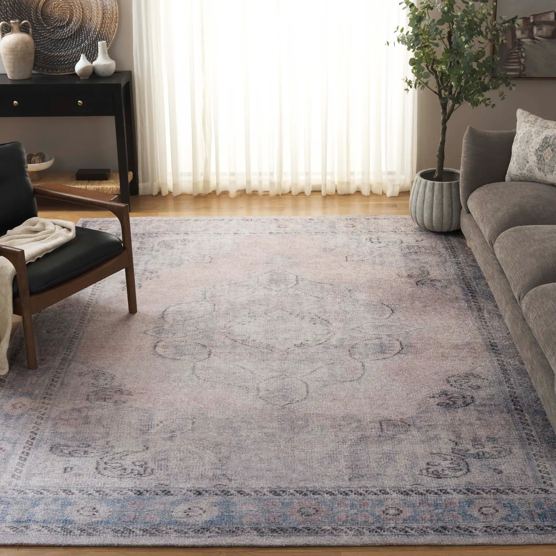 Classic Vintage Faded Ogee Medallion Hand-Tufted Rug in Gray / Beige in a styled room