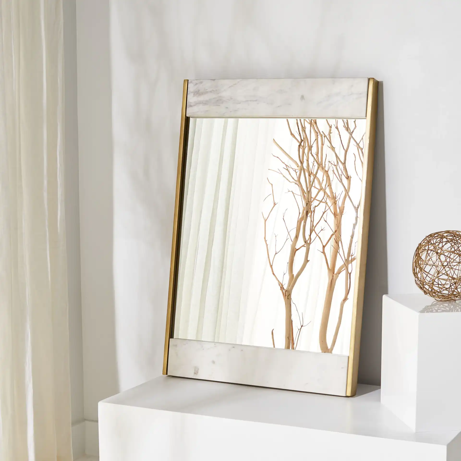 Kandi Faux Marble Mirror in White / Brass in a styled room