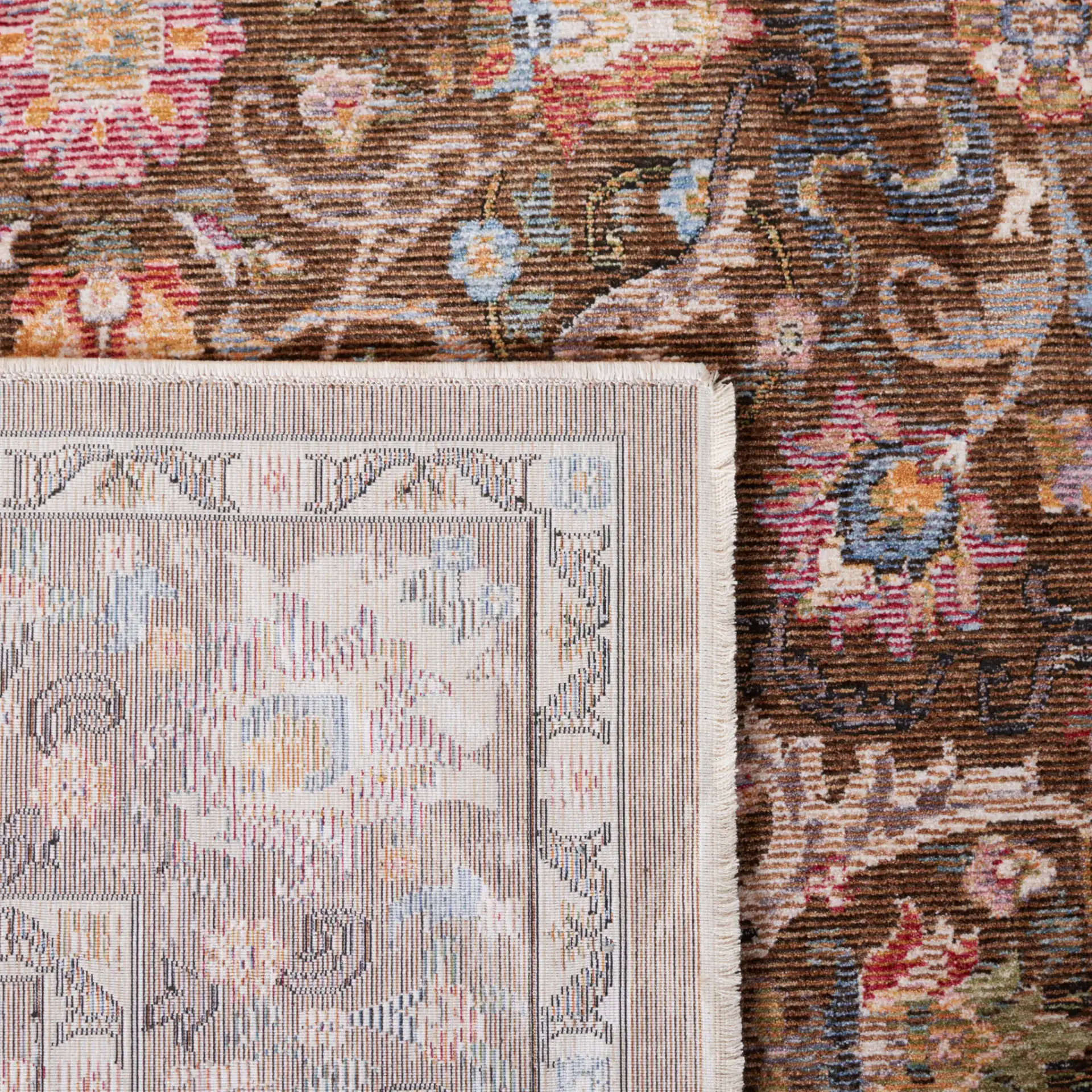 Crimson Floral Border Rug in Brown / Blue in a styled room