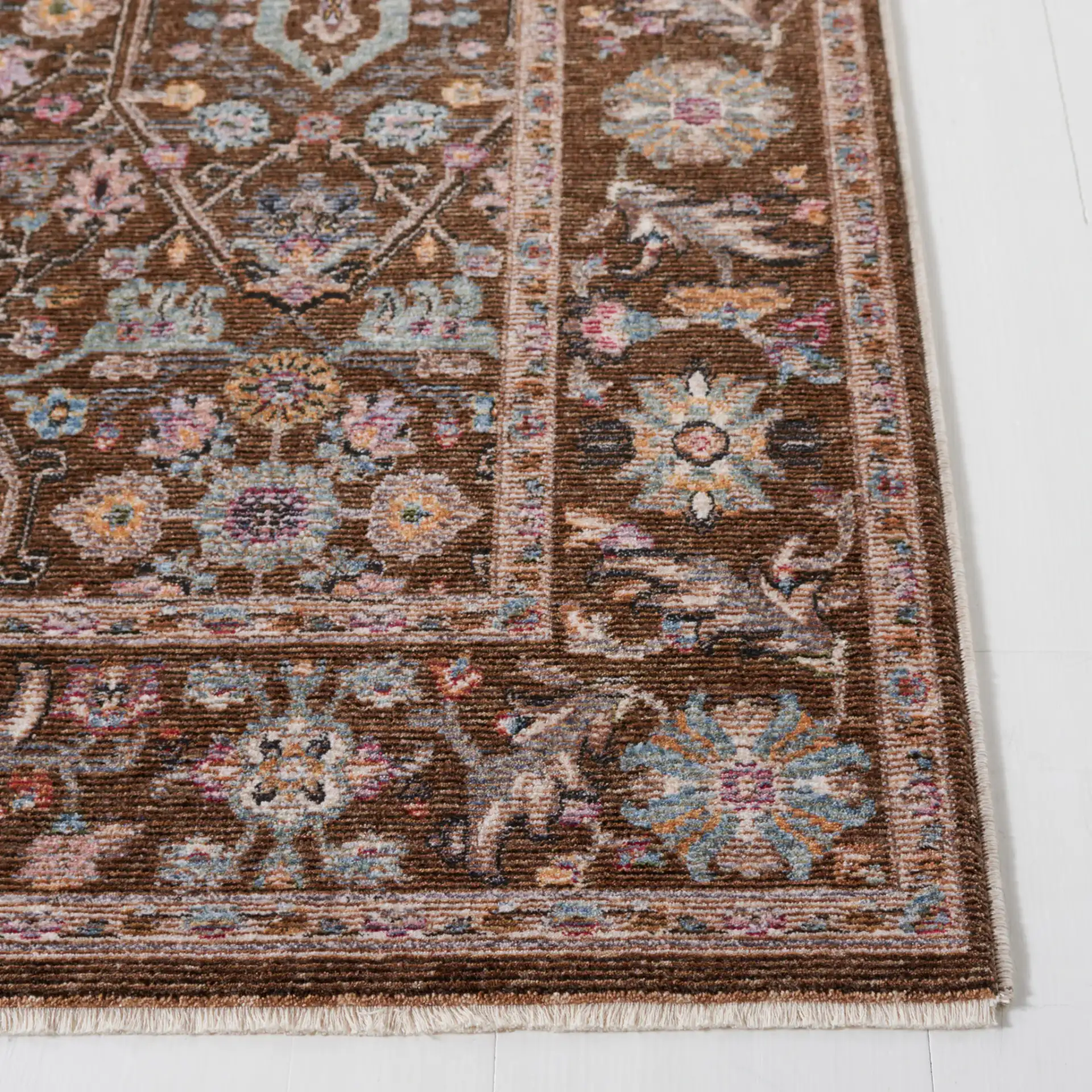 Crimson Floral Lattice Rug in Brown / Blue in a styled room