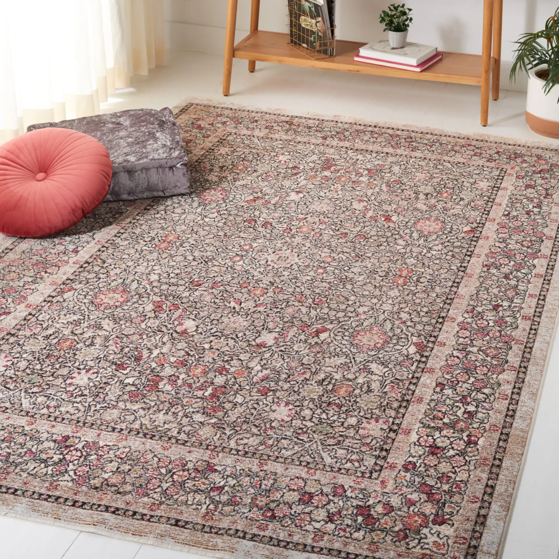 Crimson Bordered Floral Rug in Blue / Black in a styled room