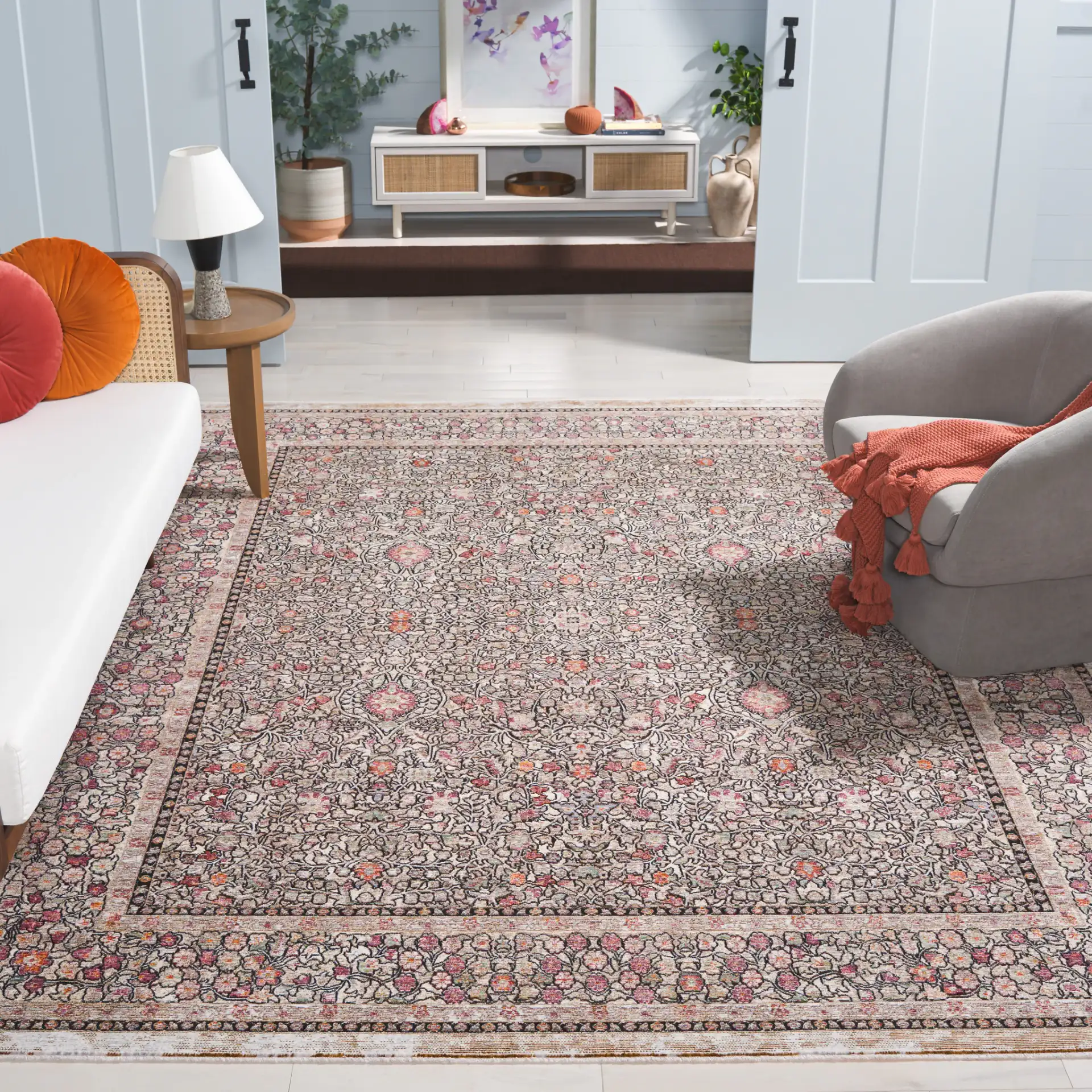 Crimson Bordered Floral Rug in Blue / Black in a styled room