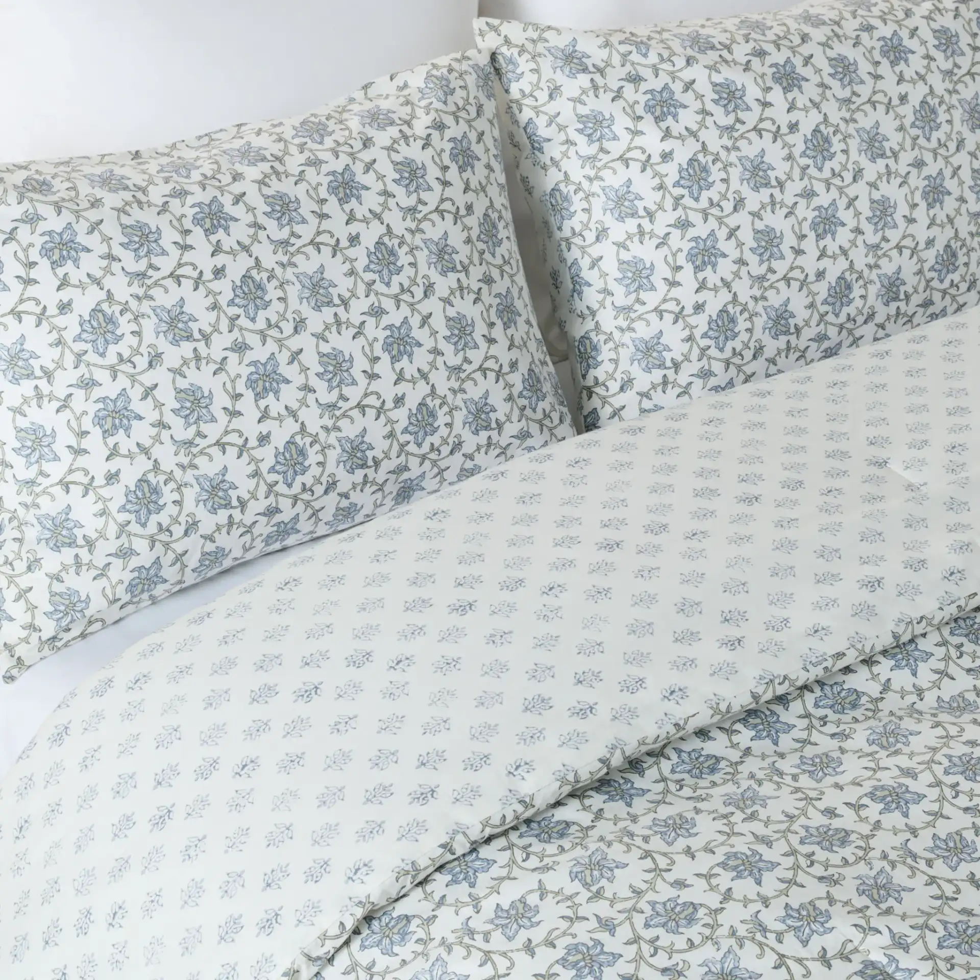 Floral Rev Comforter Set Three-Piece in Blue Mist / Sage Green in a styled room