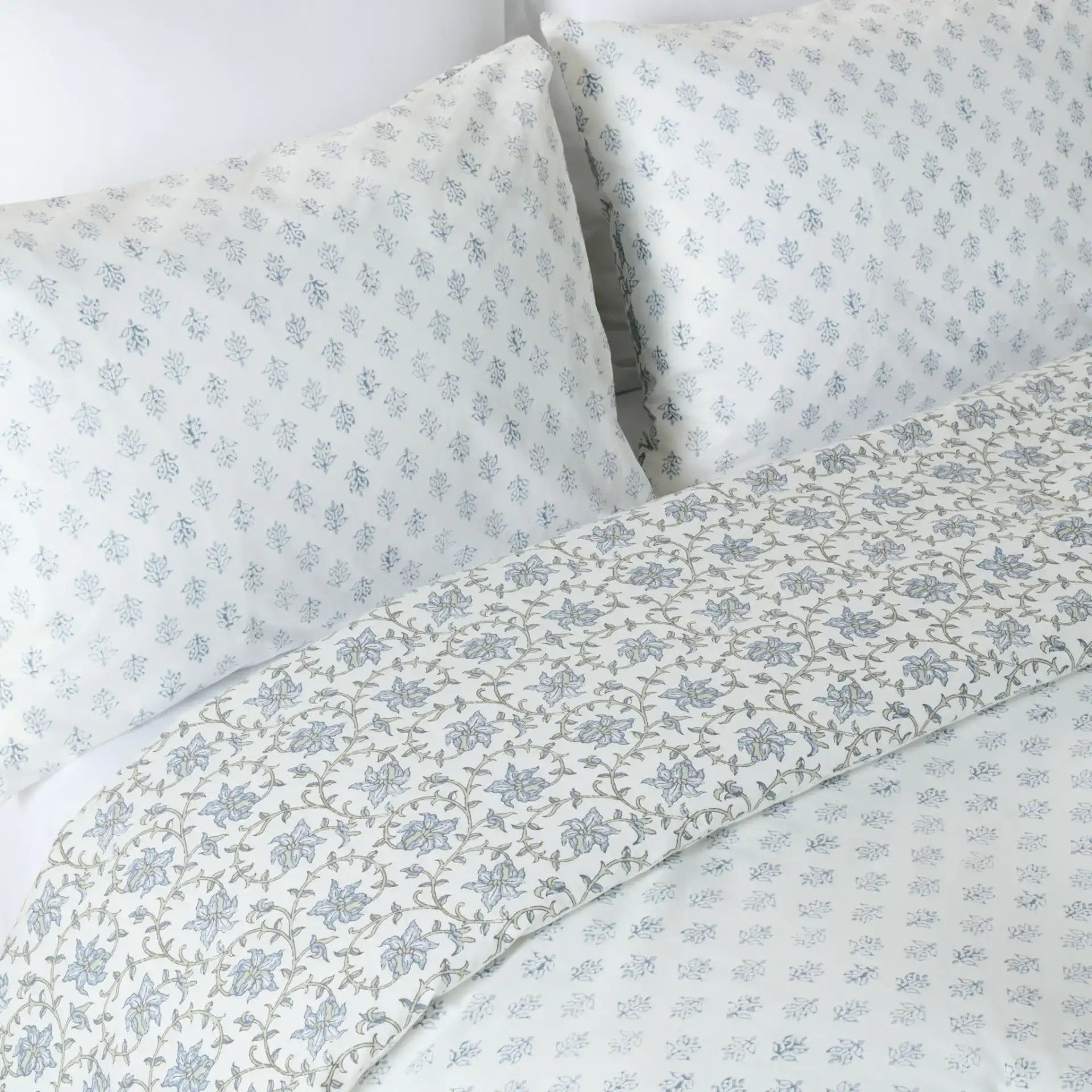 Floral Rev Comforter Set Three-Piece in Blue Mist / Sage Green in a styled room