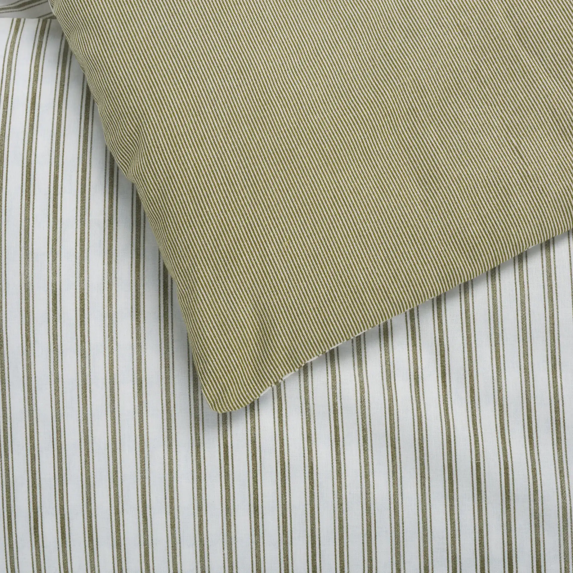 Stripe Rev Comforter Set Three-Piece in Olive / White in a styled room