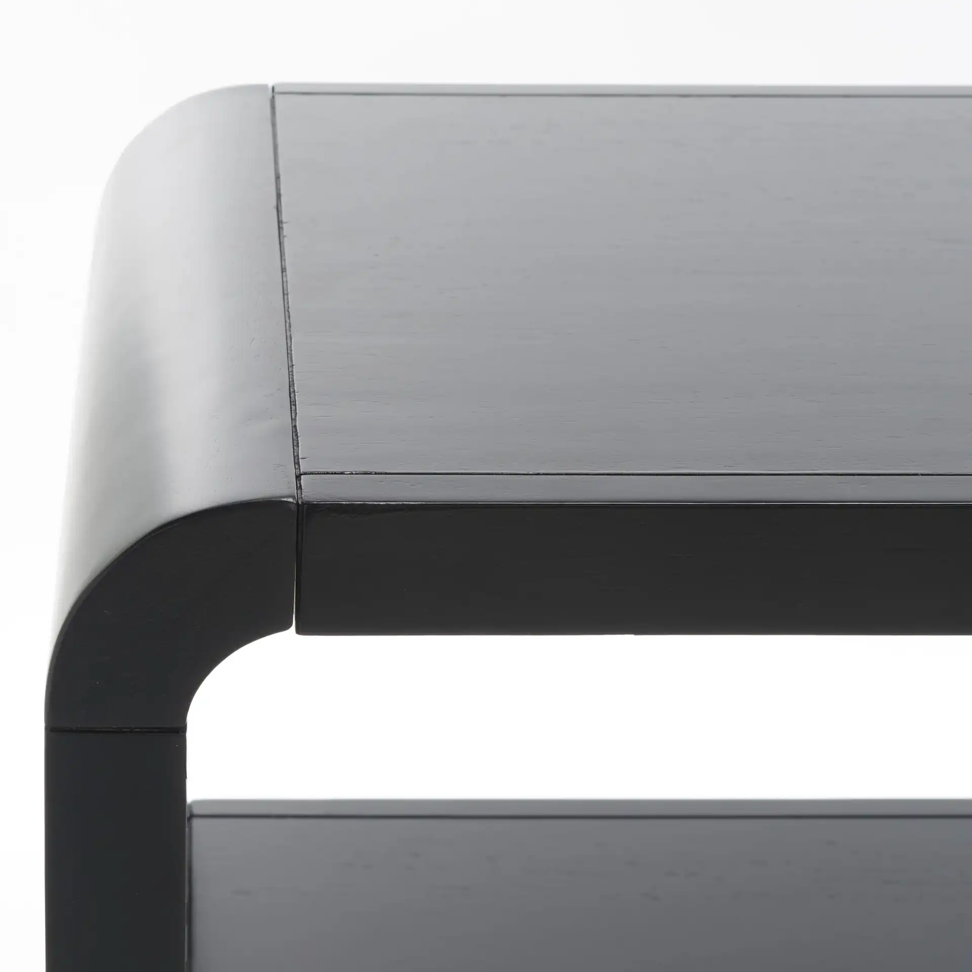 Omara Two-Tier Console Table in Black in a styled room