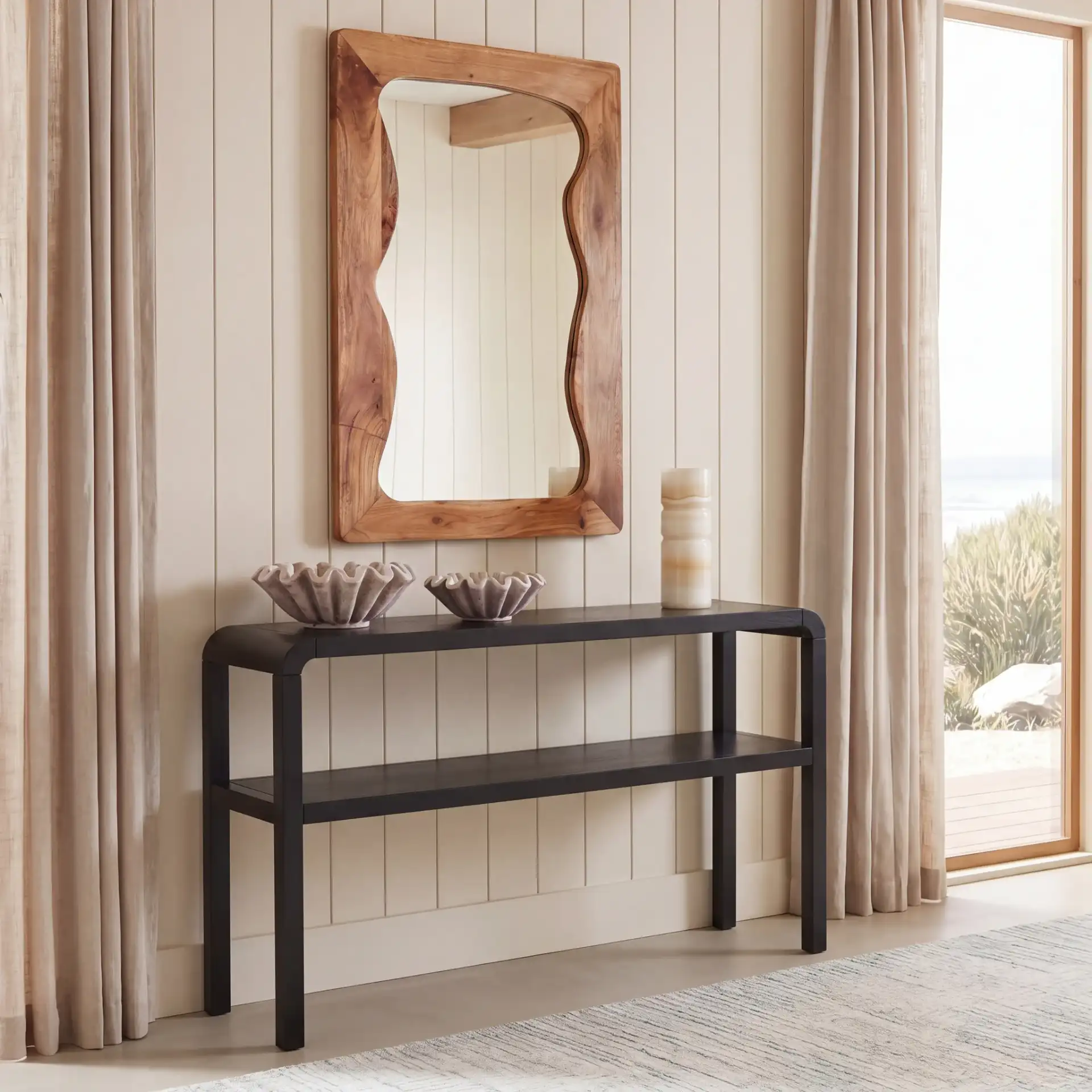 Omara Two-Tier Console Table in Black in a styled room
