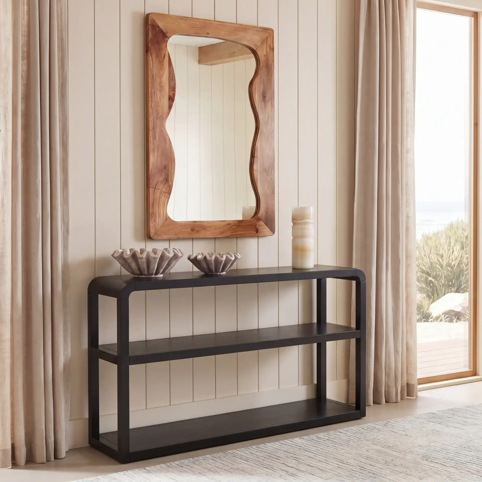 Omara Three-Tier Console Table in Black in a styled room