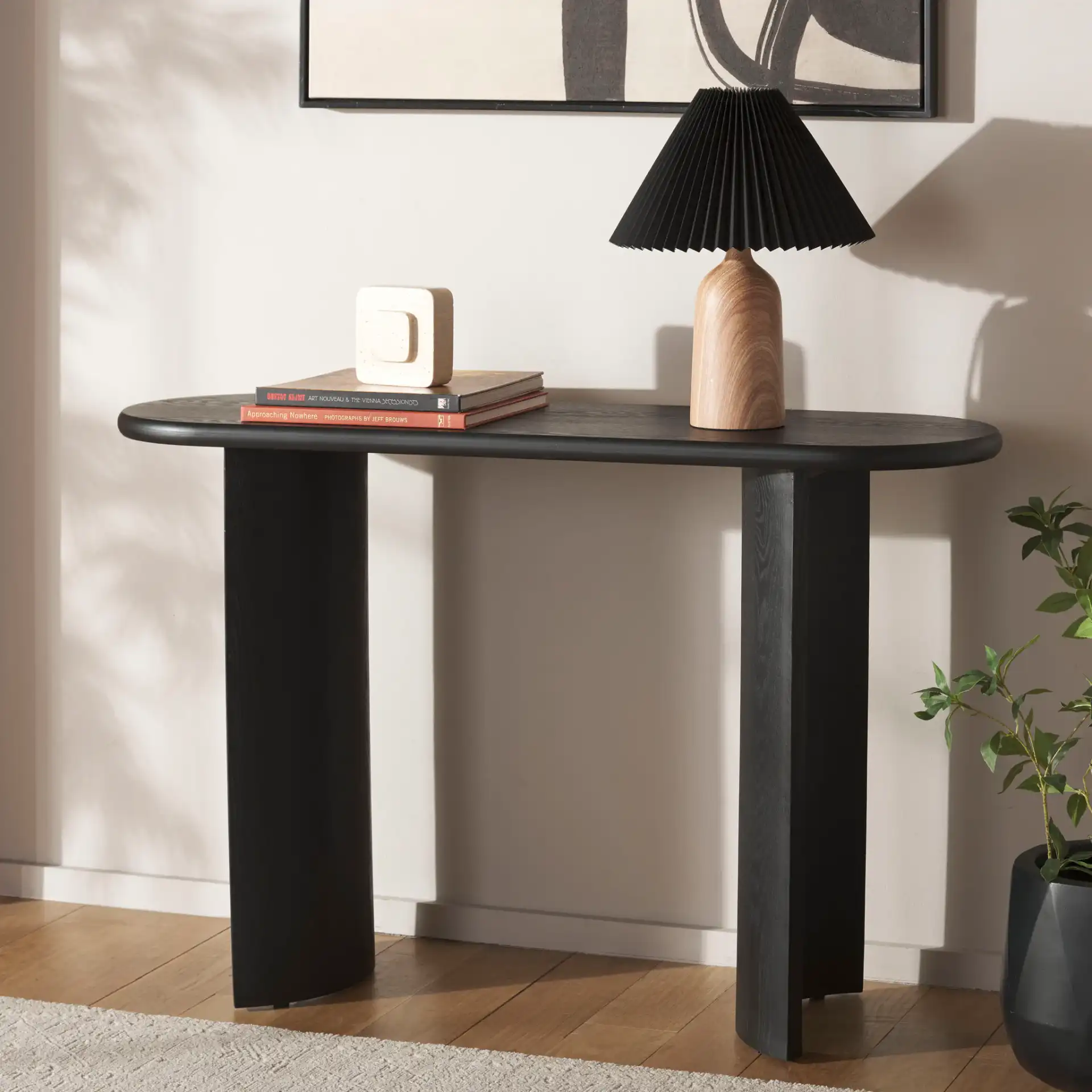 Koka Console Table in Black in a styled room