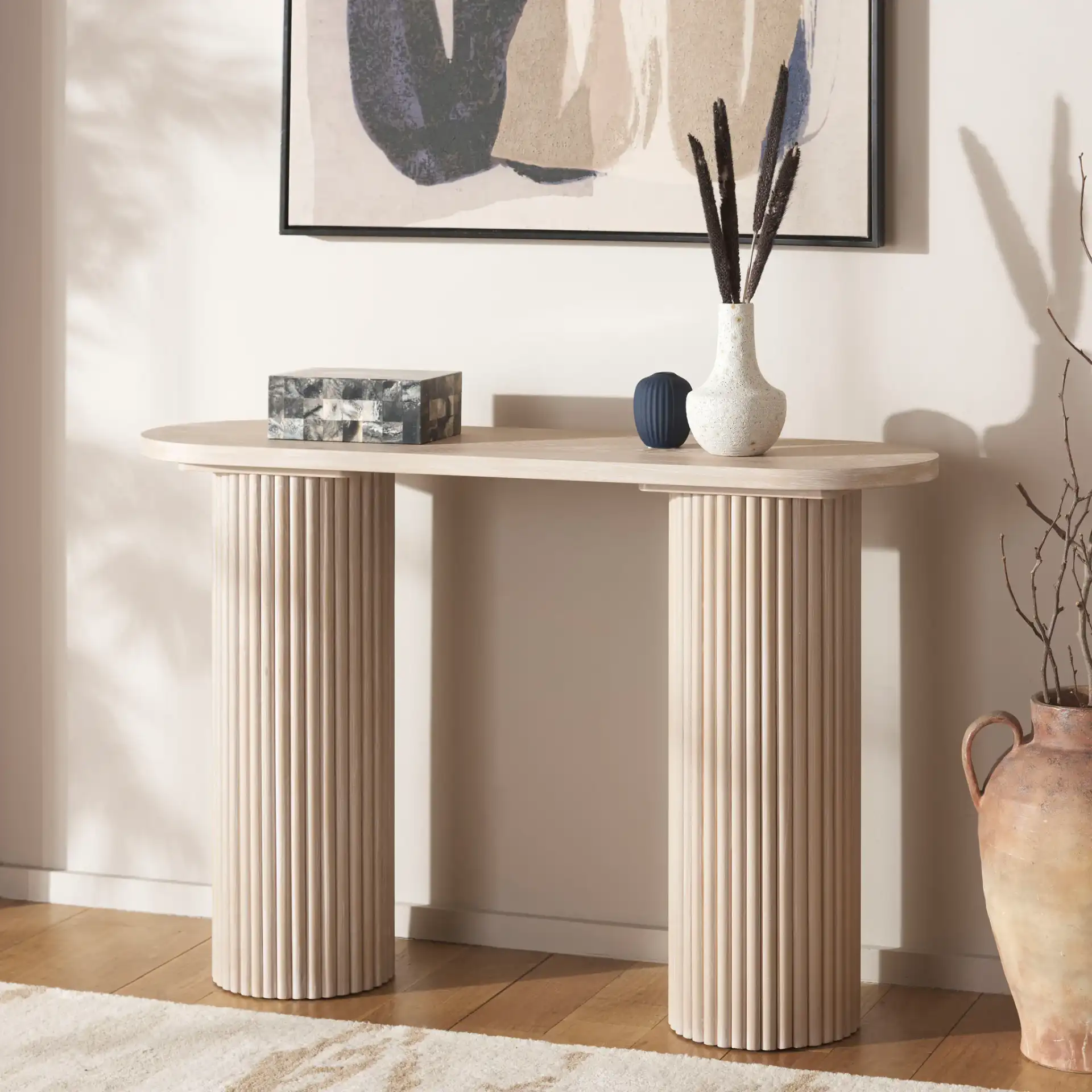 Raicha Console Table in Bleached White in a styled room