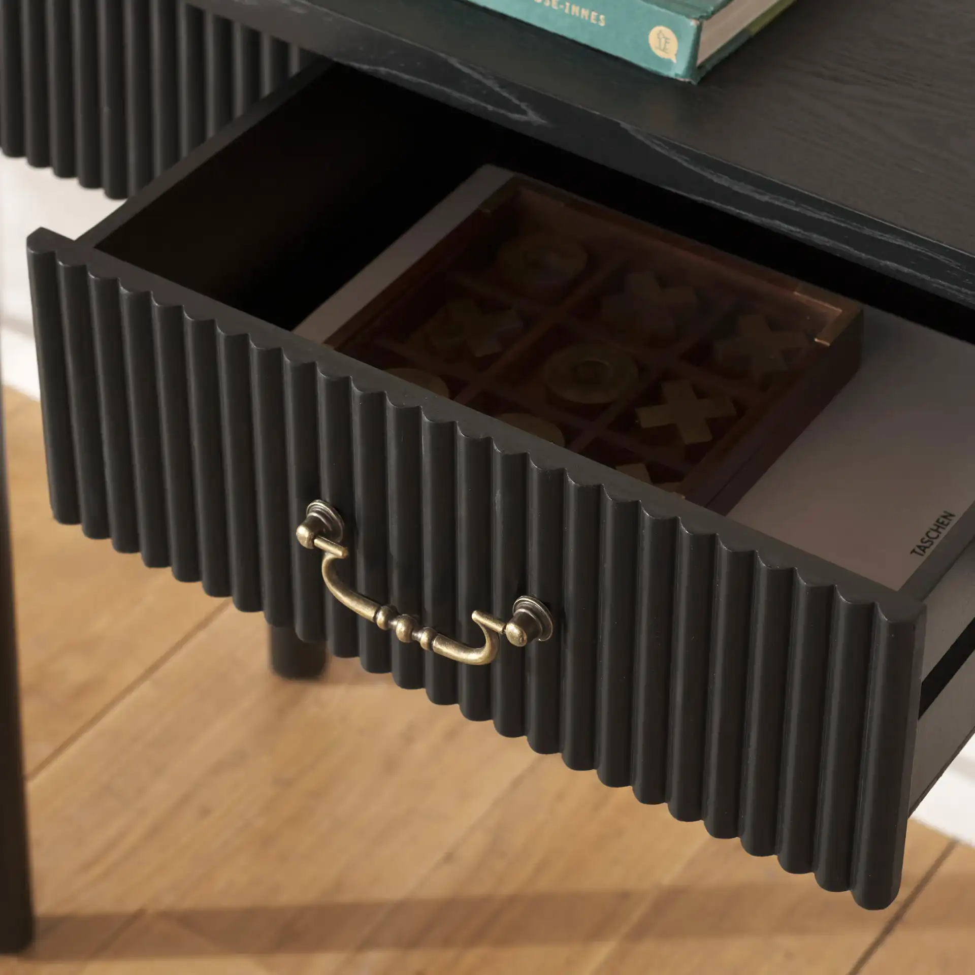 Hanaka One-Drawer Console Table in Black in a styled room