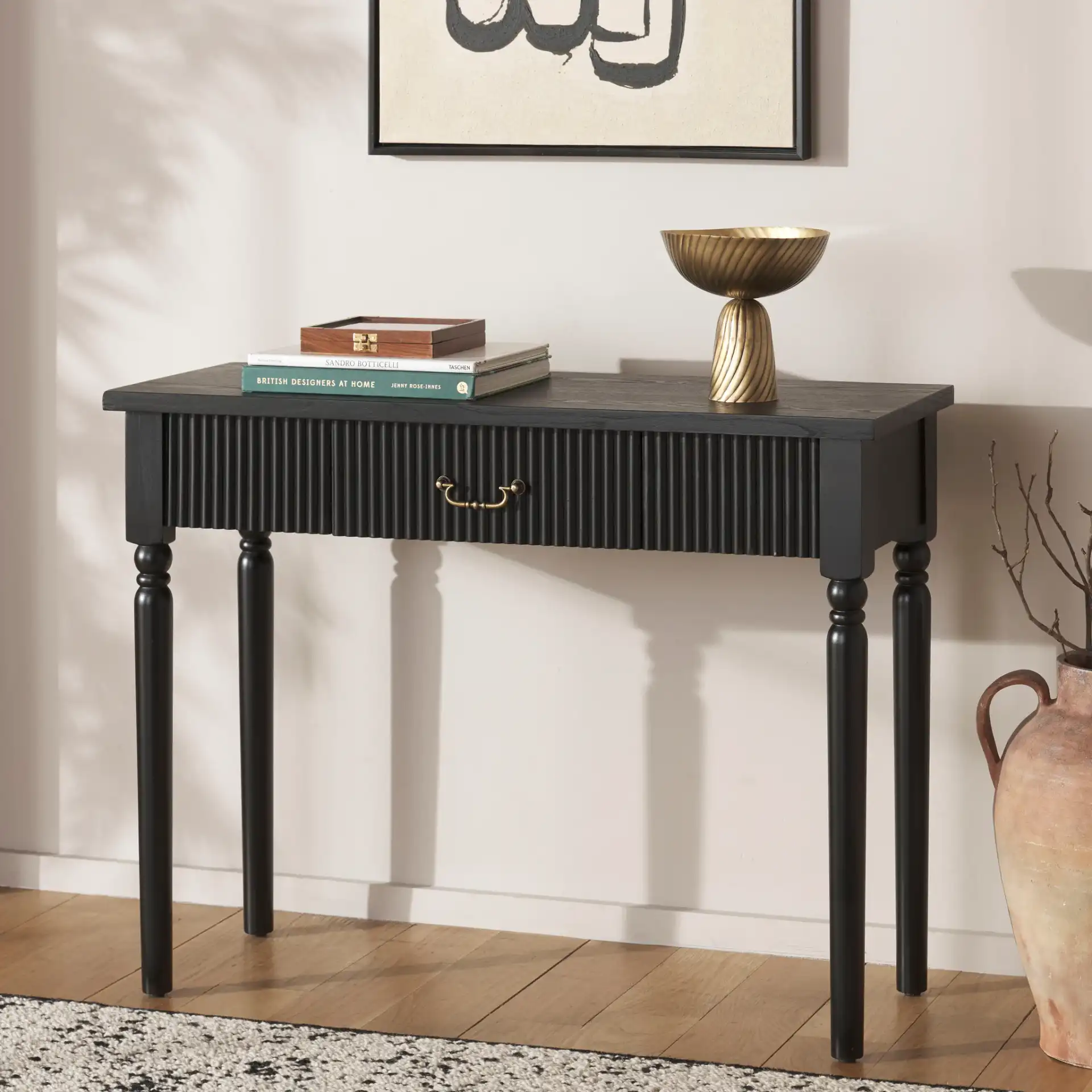 Hanaka One-Drawer Console Table in Black in a styled room