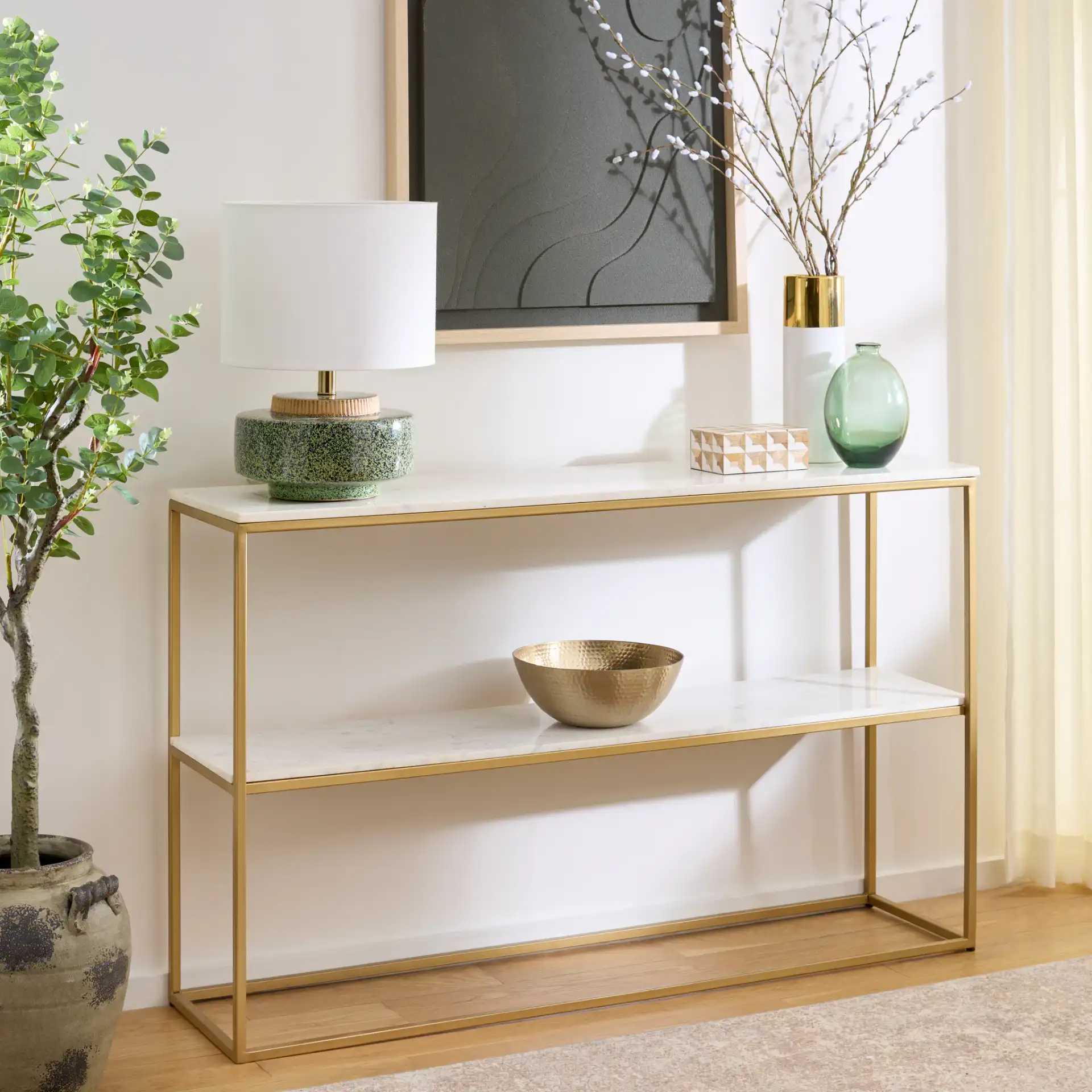 Kenna Marble Console Table in White Marble / Gold in a styled room