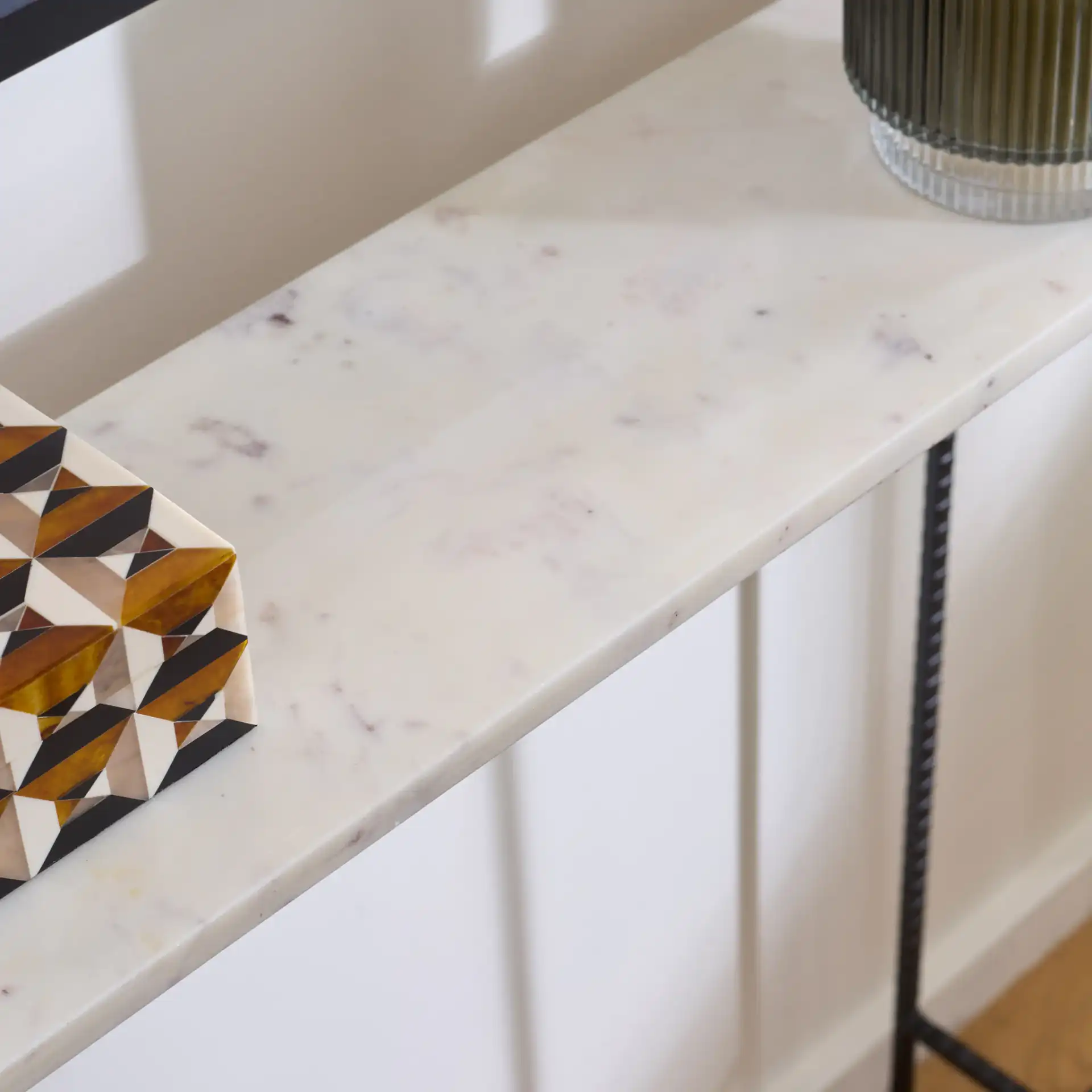 Cale Marble Console Table in White Marble / Black in a styled room
