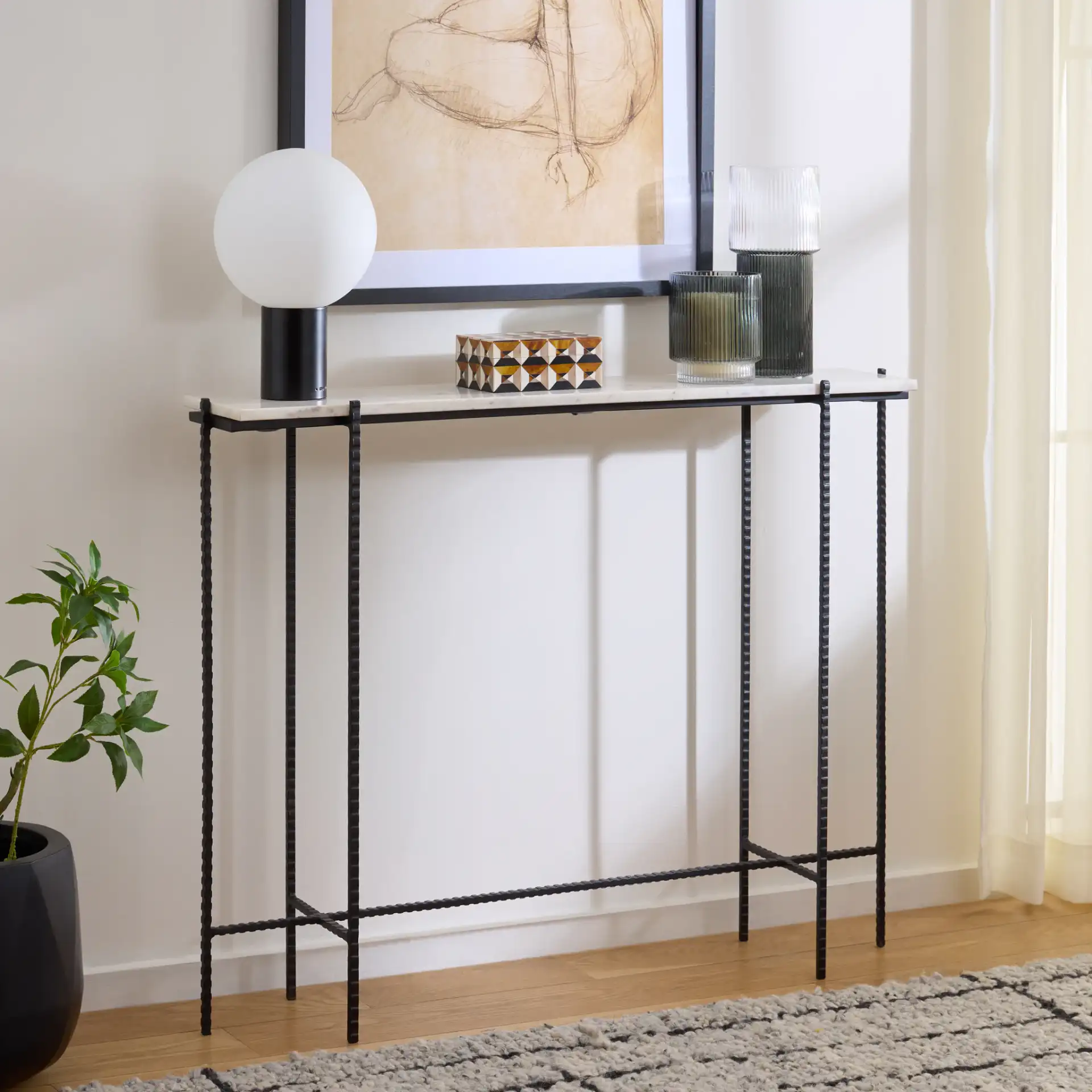 Cale Marble Console Table in White Marble / Black in a styled room