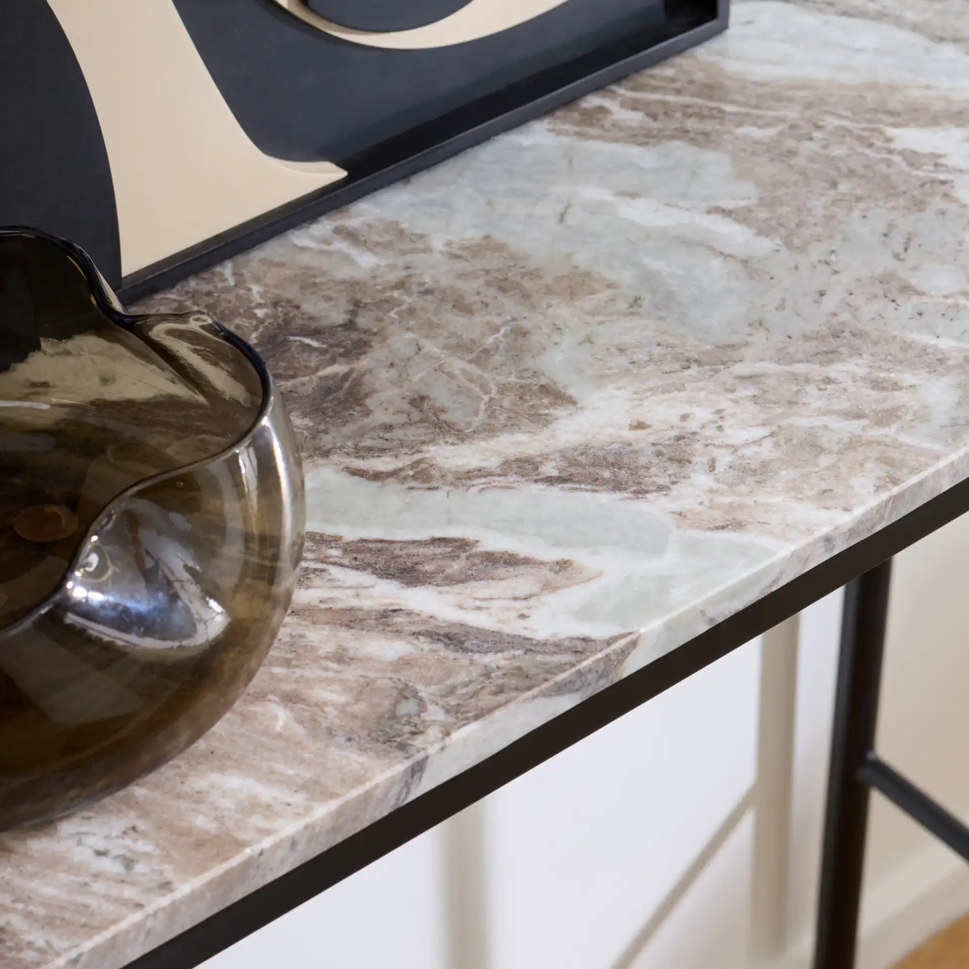 Frederick Marble Console Table in Brown Gray / Black in a styled room