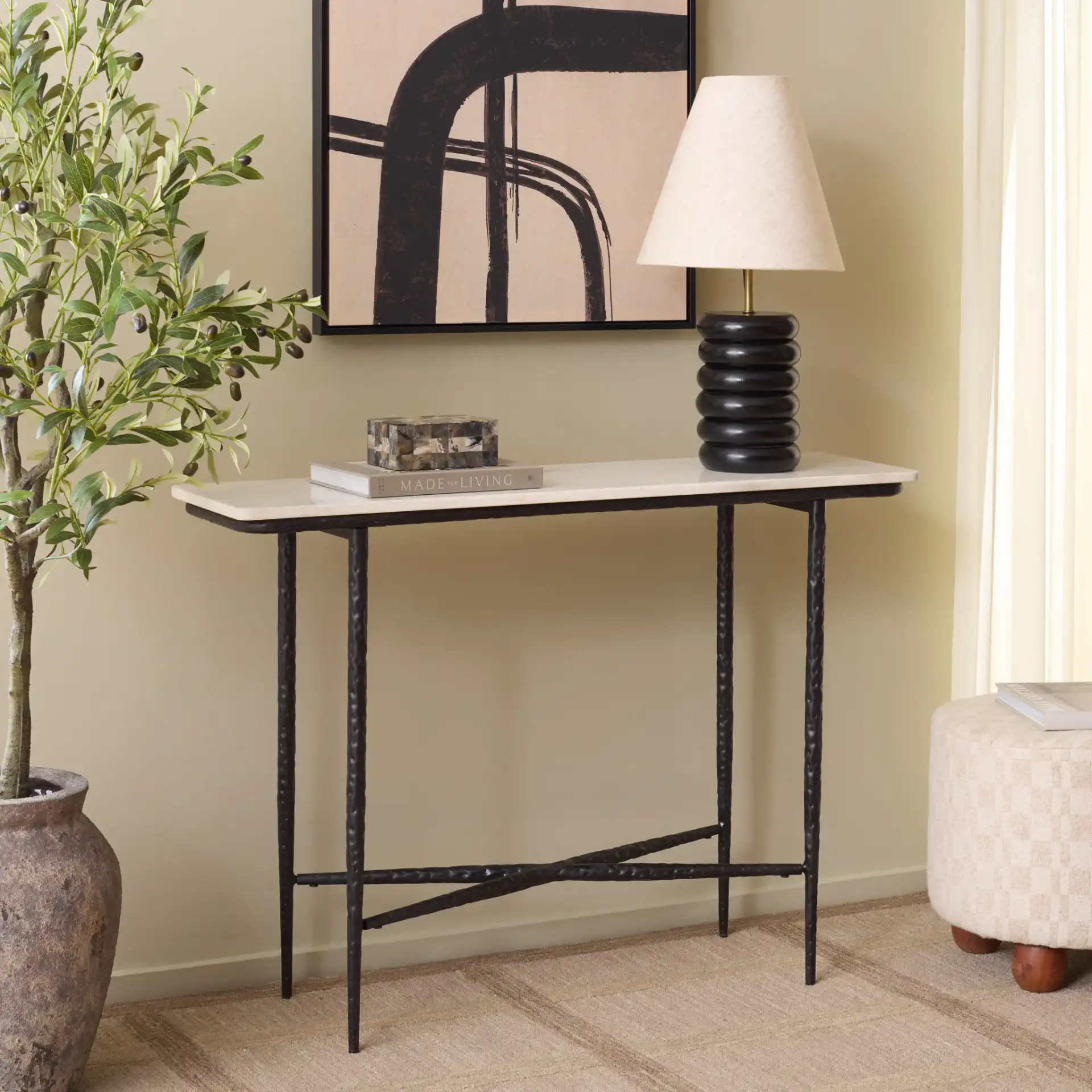 Raisa Marble Console Table in White / Black in a styled room