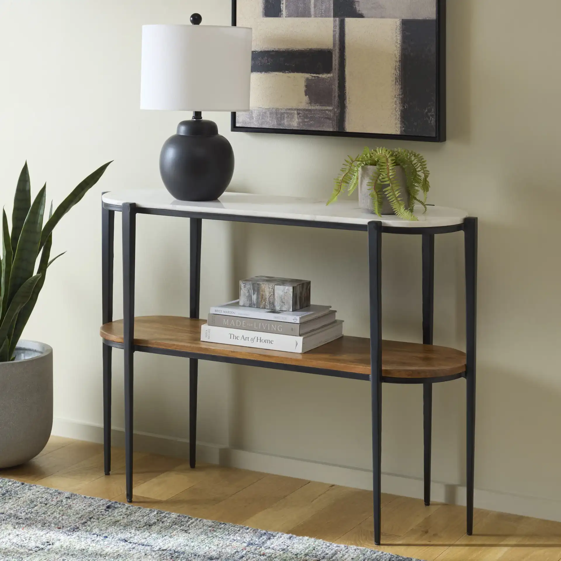 Shani 2 Tiered Console Table in Black / Natural White in a styled room