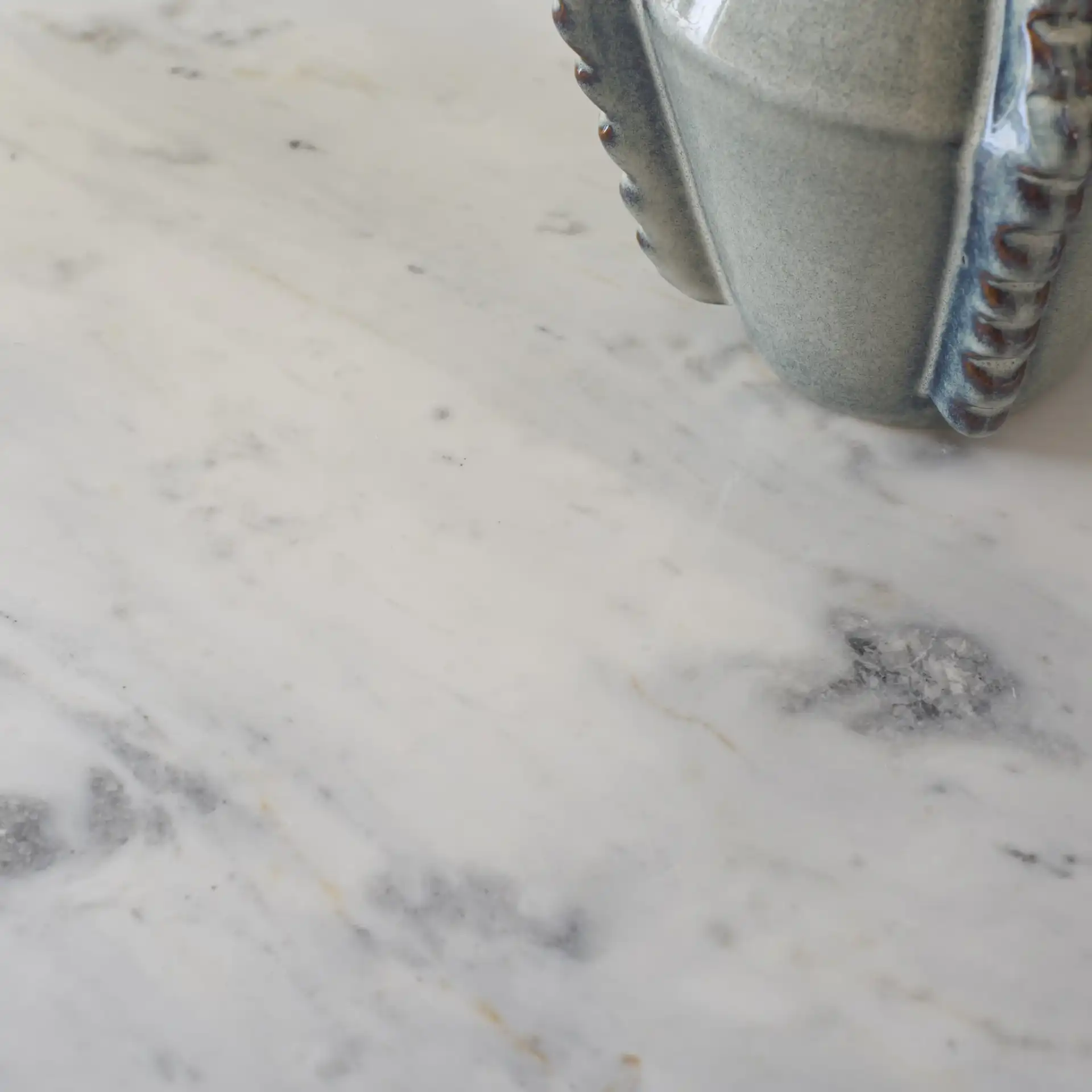 Lorraine Marble Console Table in Smokey Gray Brown / White in a styled room
