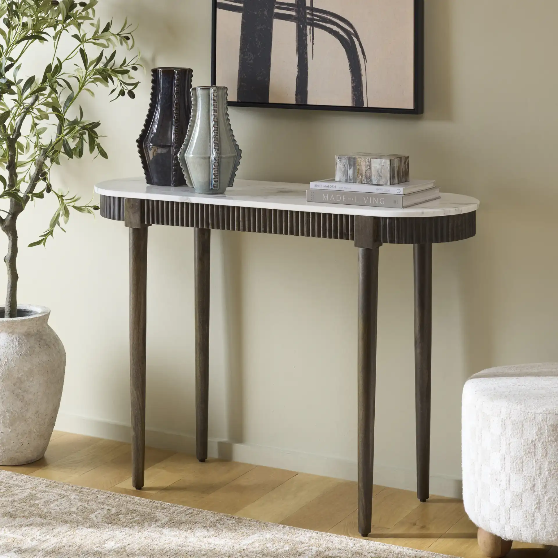 Lorraine Marble Console Table in Smokey Gray Brown / White in a styled room