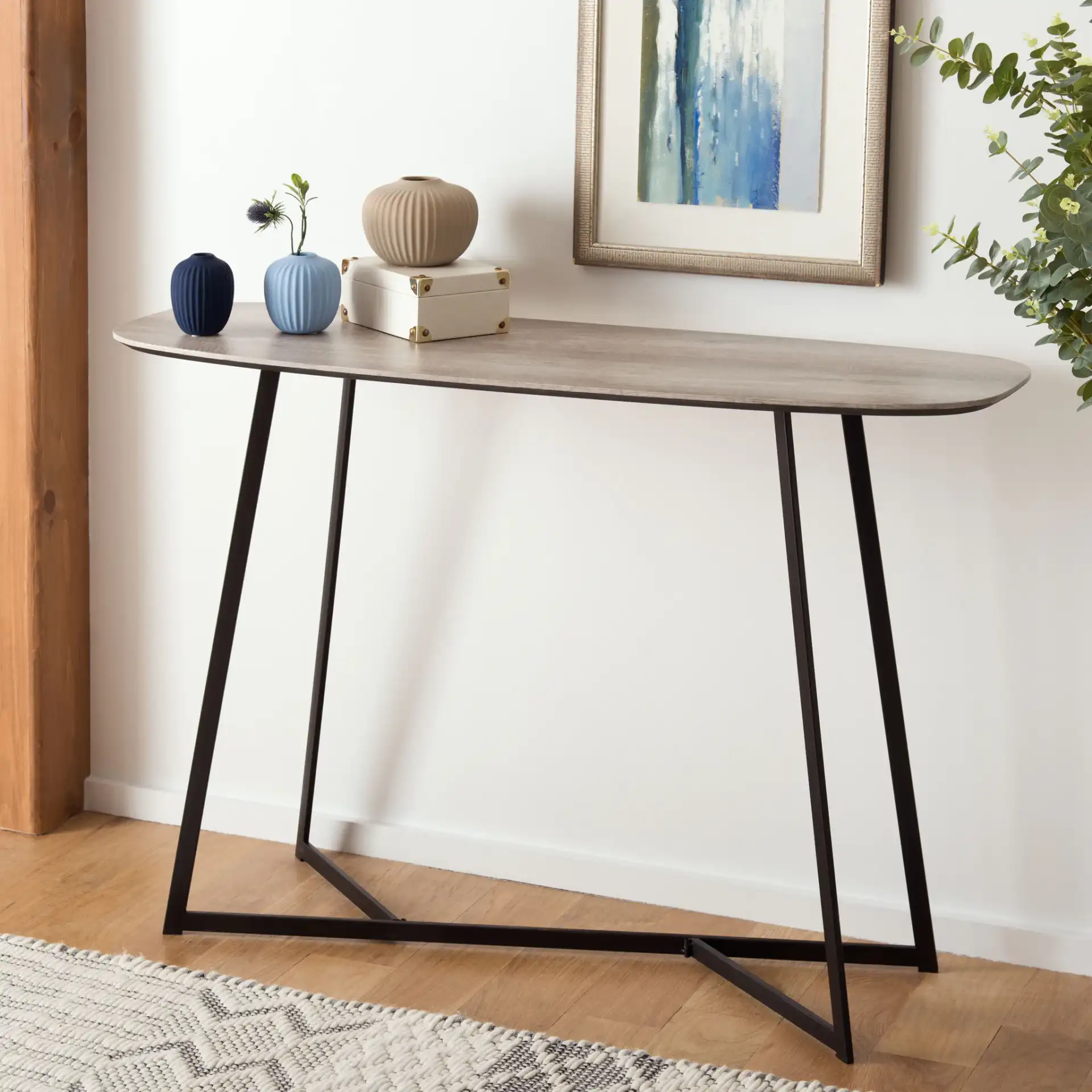 Arrington Console Table in White / Black in a styled room