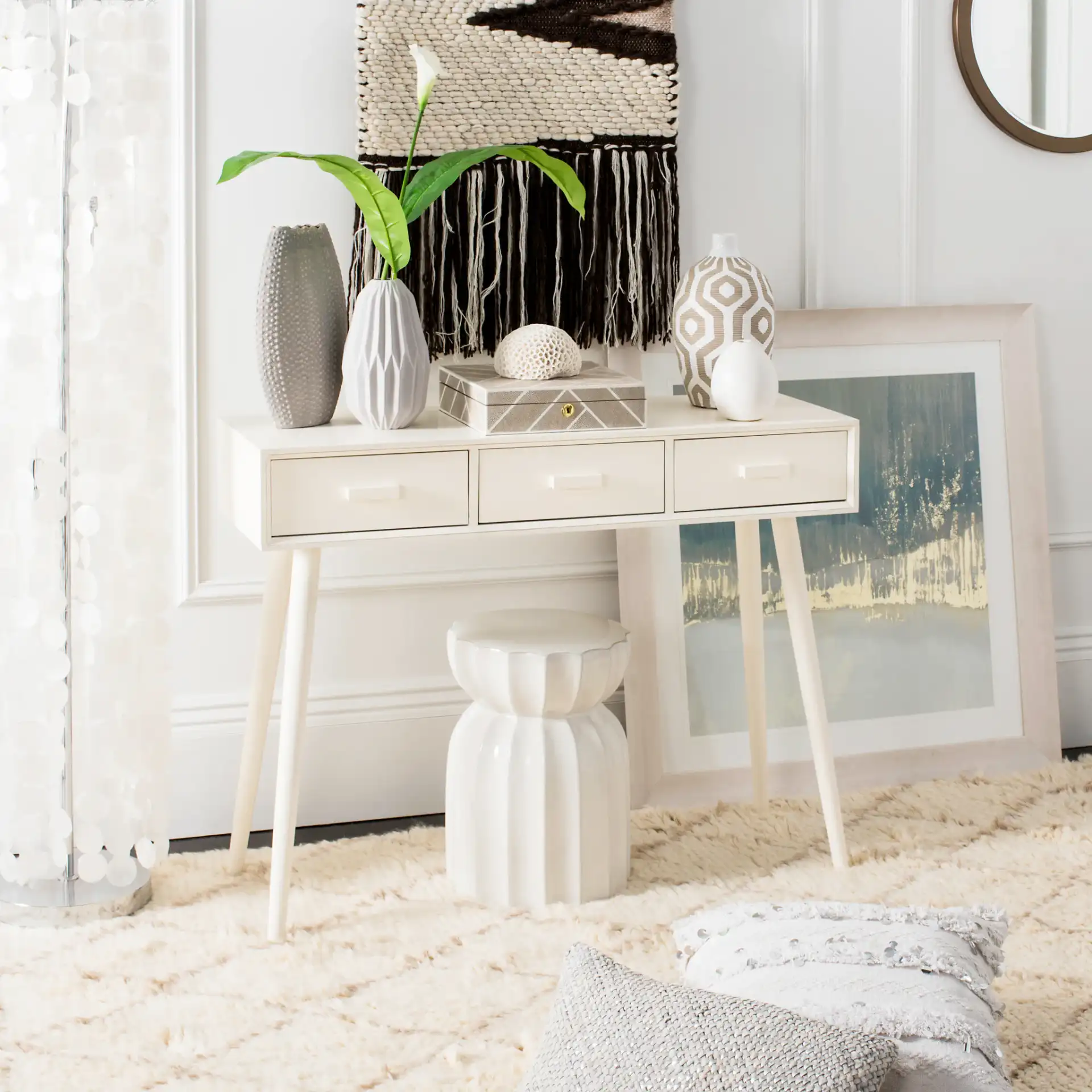 Albus Three-Drawer Console Table in Antique White in a styled room