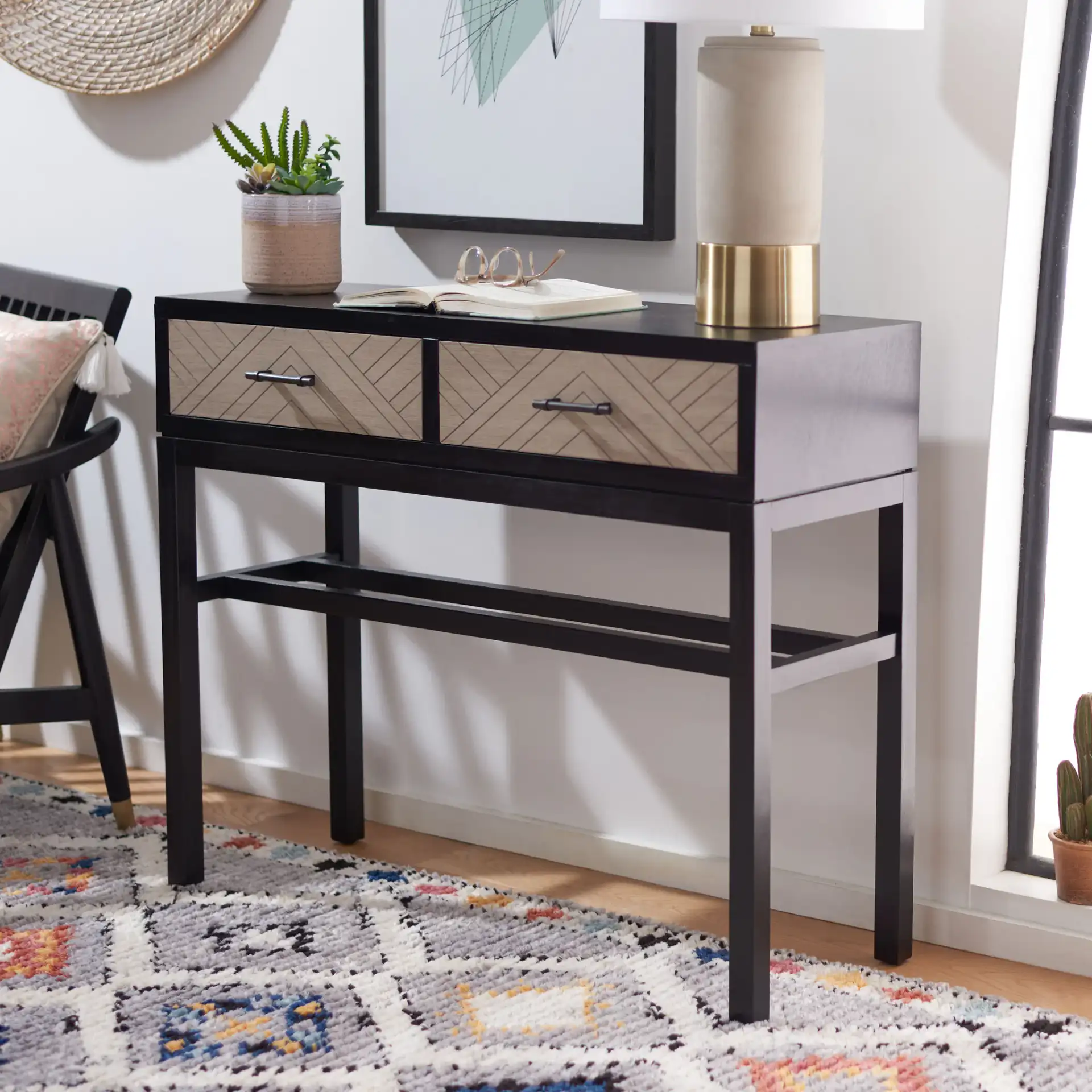 Ajana Two-Drawer Console Table in Black / Greige in a styled room