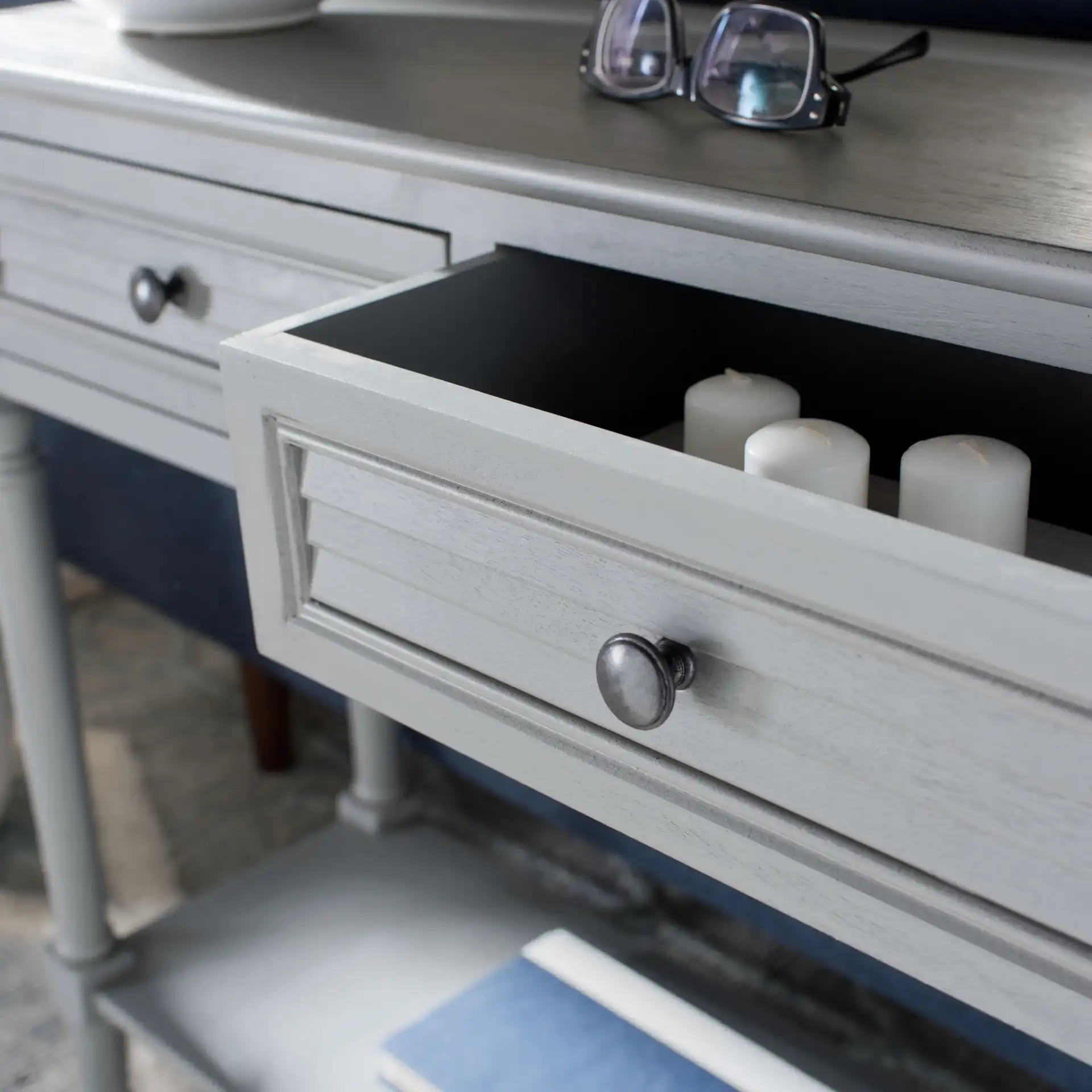 Tate Two-Drawer Console Table in Distressed Gray in a styled room